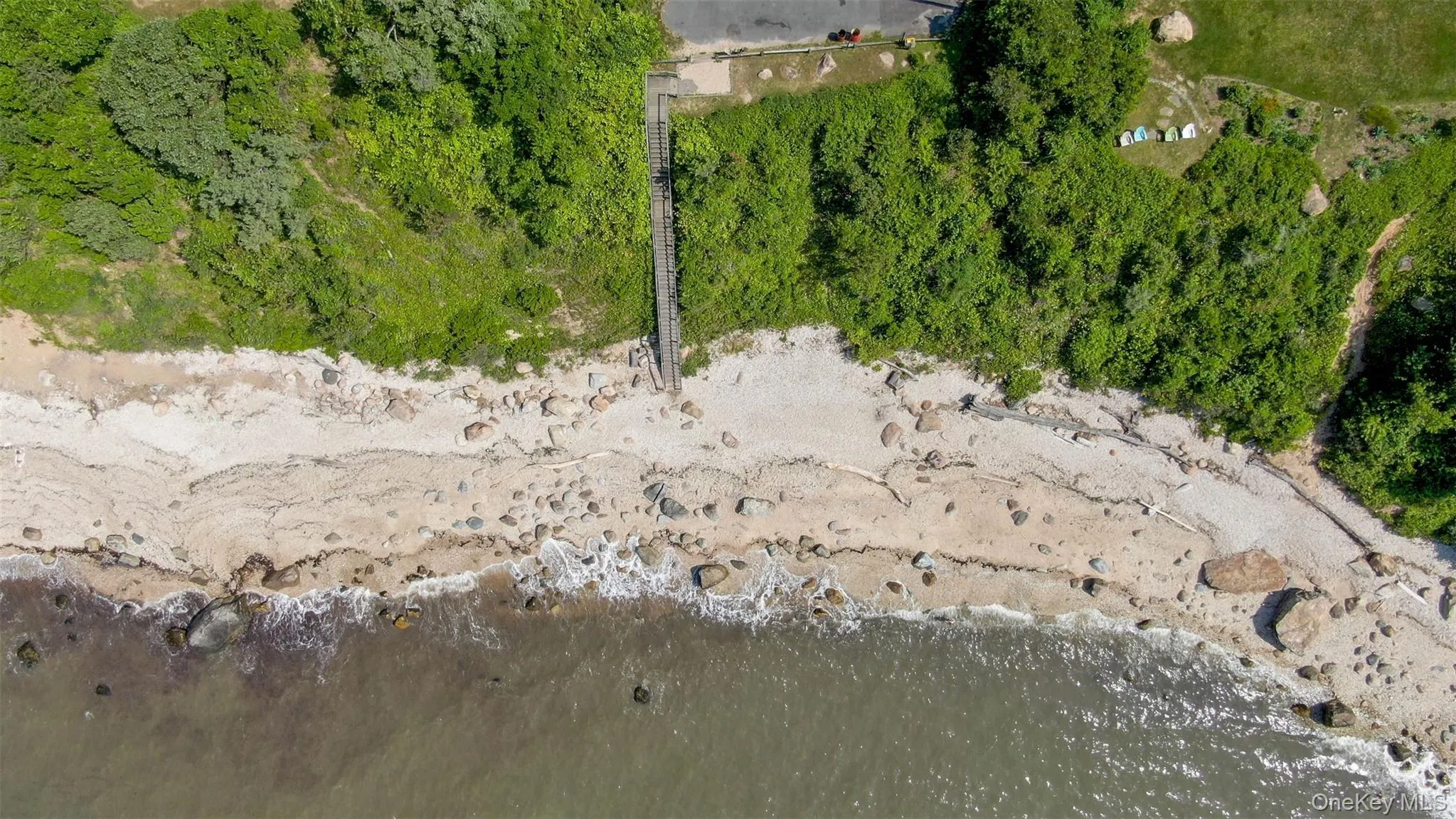 Aerial overview of property's location with a nearby body of water Aerial overview of property's location with a nearby body of water