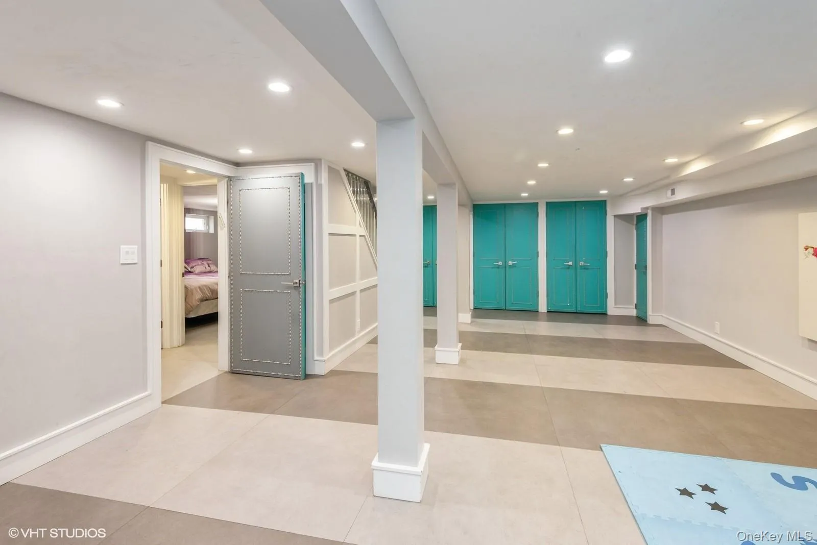 Exercise area featuring recessed lighting and light tile patterned floors Exercise area featuring recessed lighting and light tile patterned floors
