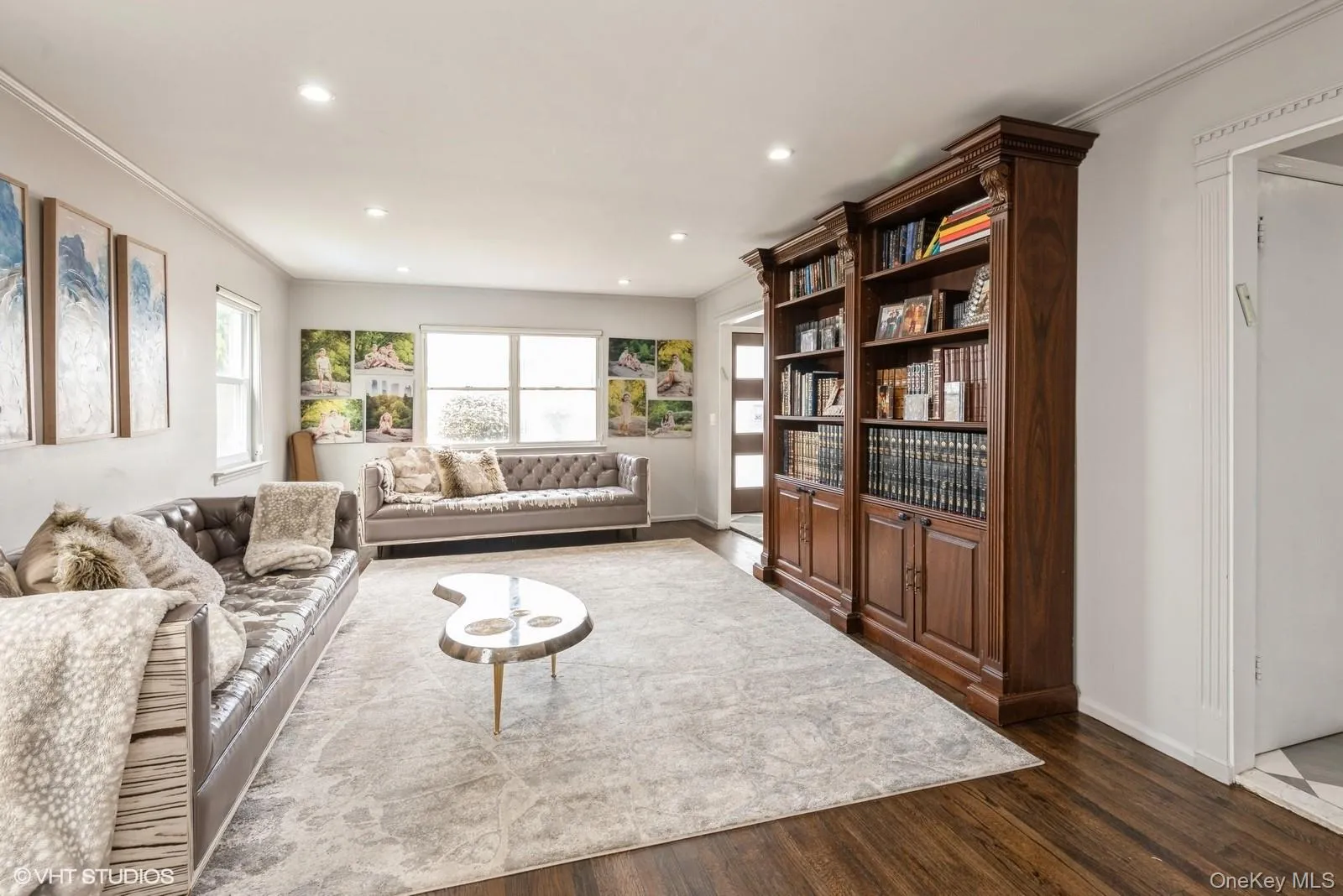 Living room featuring crown molding, dark wood finished floors, and recessed lighting Living room featuring crown molding, dark wood finished floors, and recessed lighting