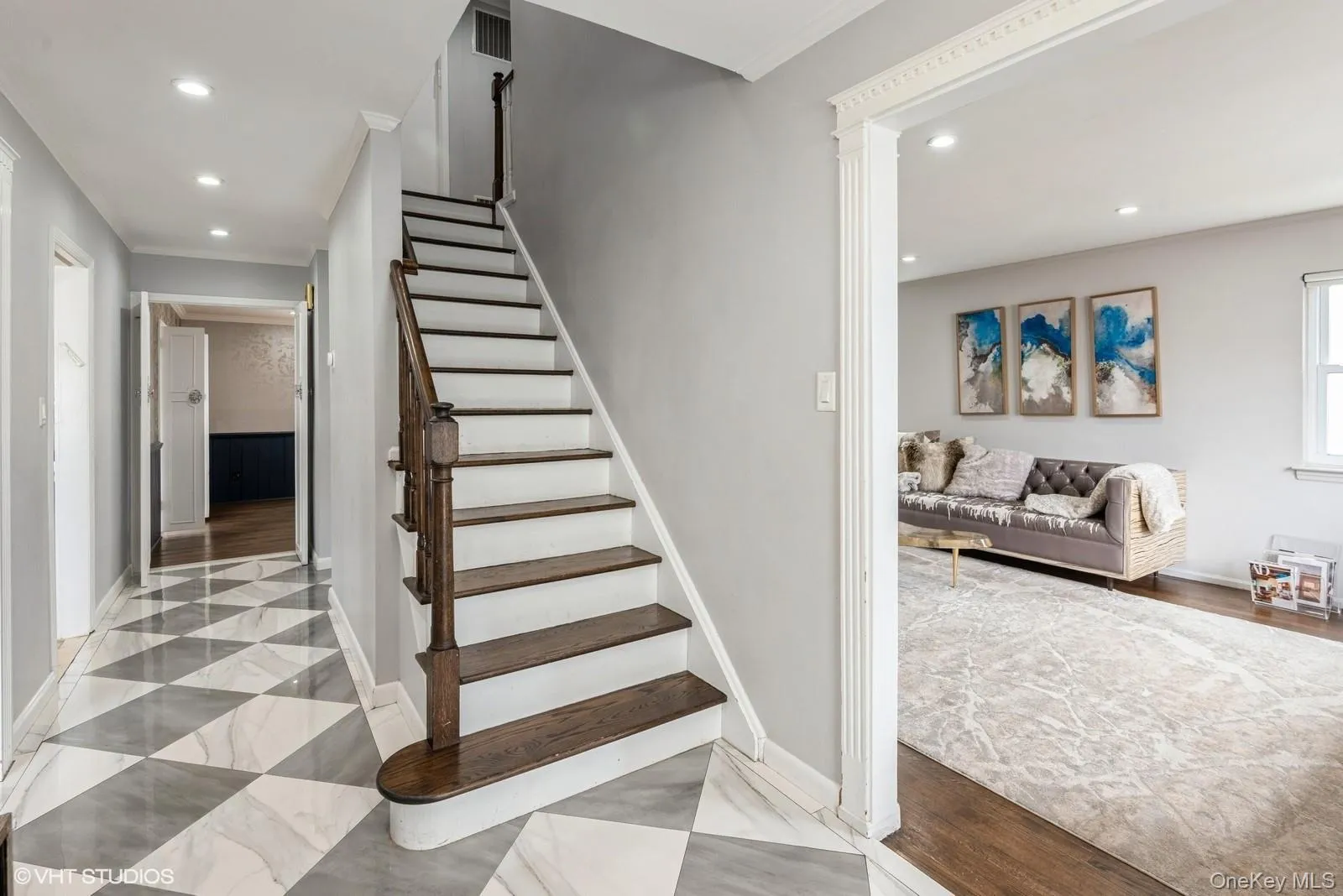 Stairs featuring recessed lighting and ornamental molding Stairs featuring recessed lighting and ornamental molding