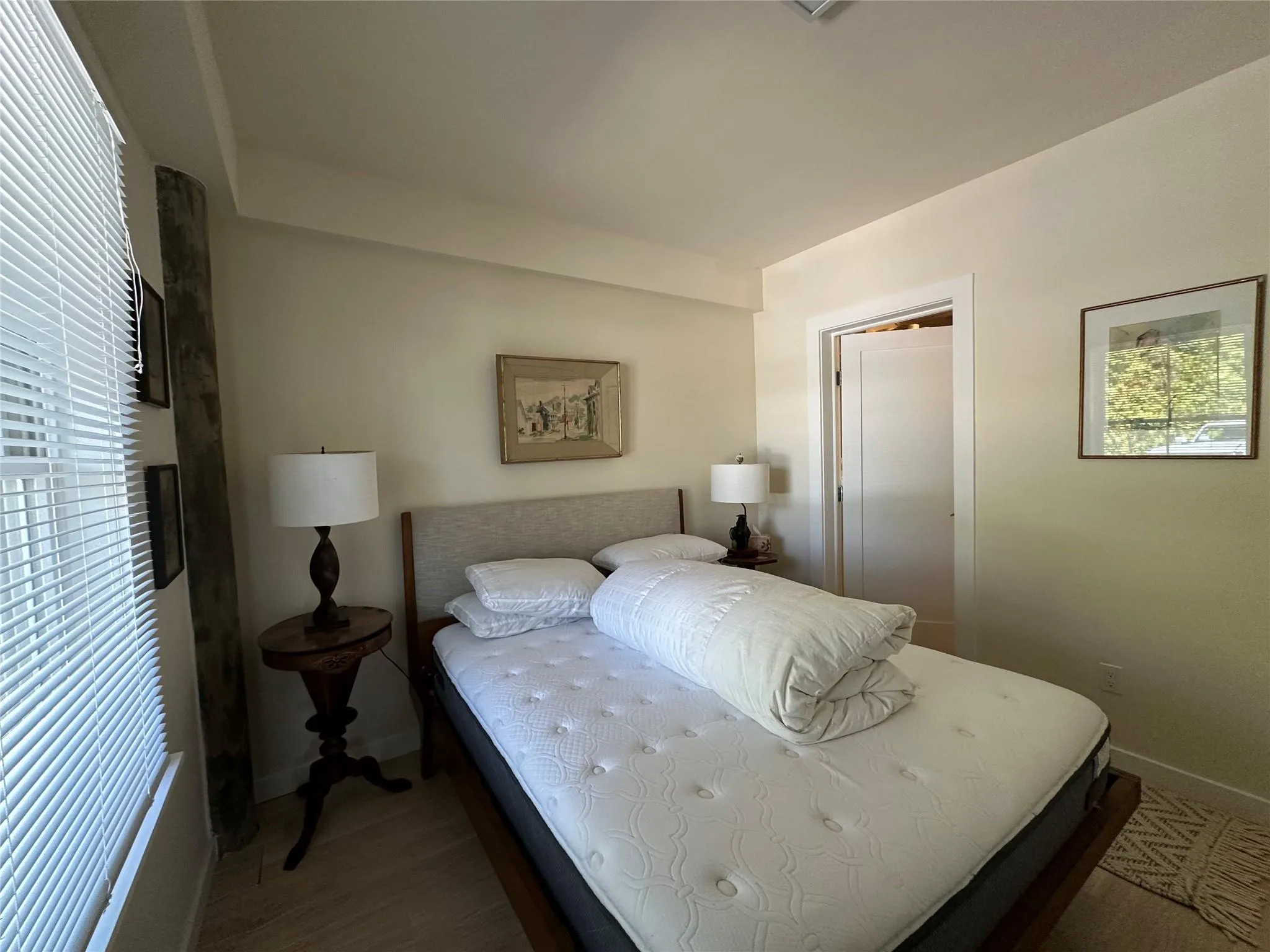 Bedroom with baseboards and wood finished floors Bedroom with baseboards and wood finished floors