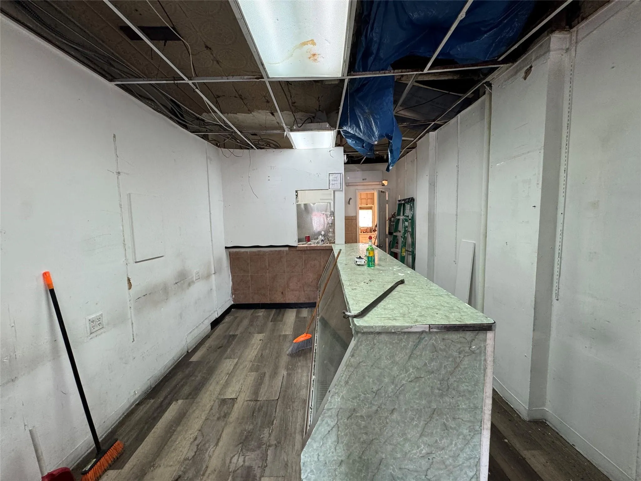 Unfinished basement featuring dark wood-type flooring Unfinished basement featuring dark wood-type flooring