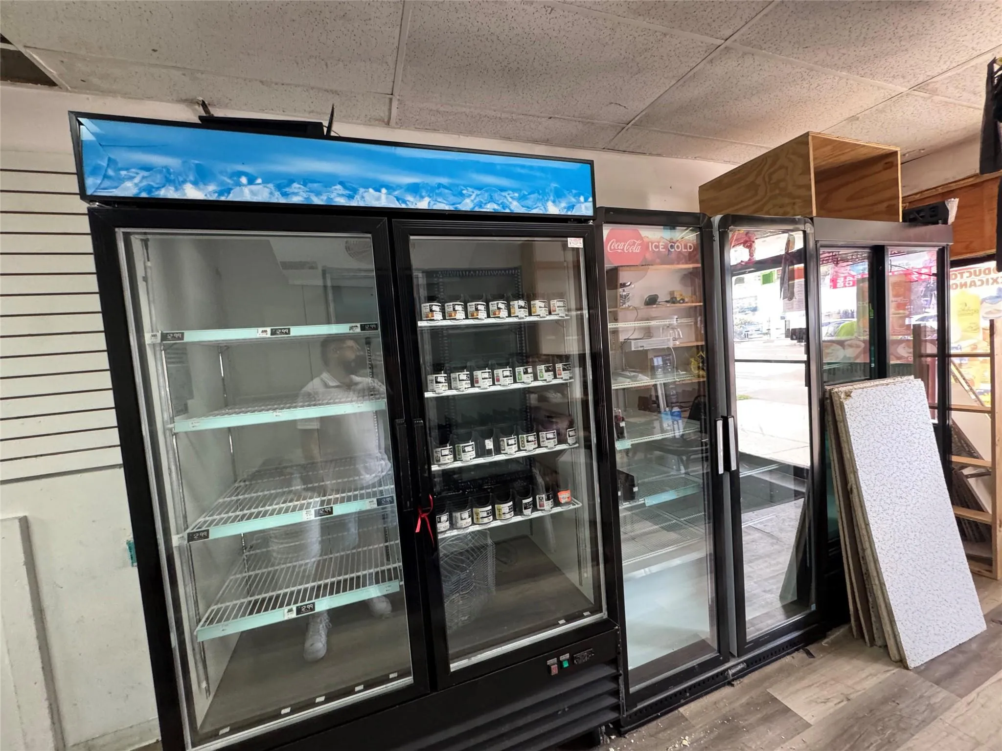 Wine room with wood finished floors and a drop ceiling Wine room with wood finished floors and a drop ceiling