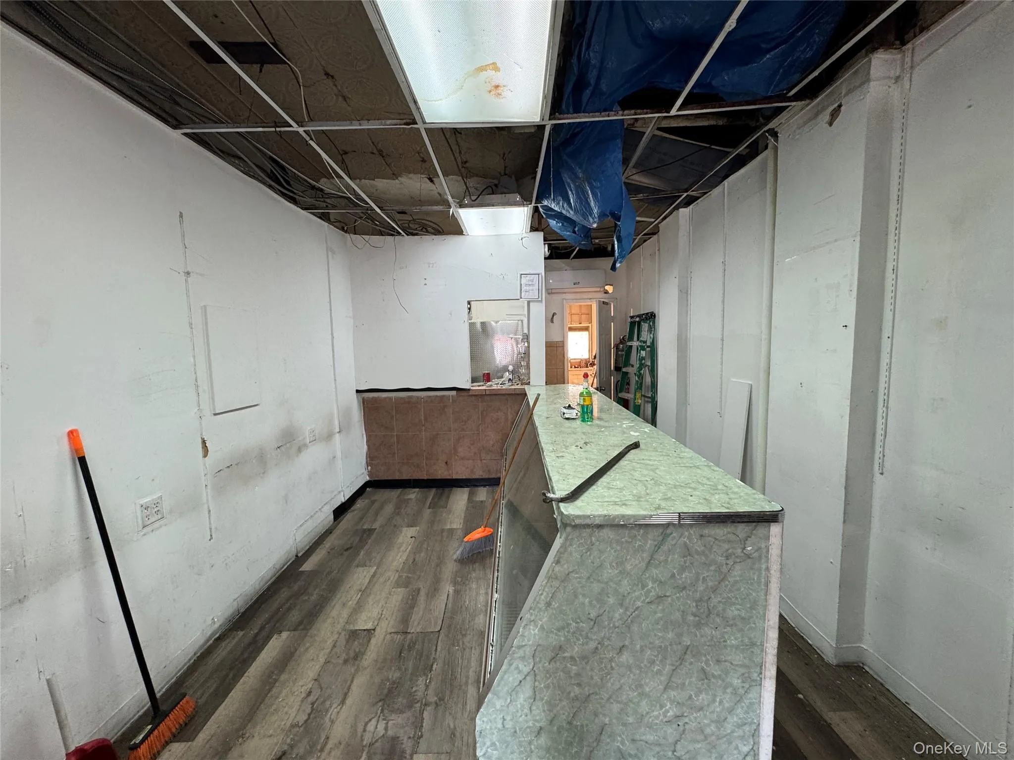 Unfinished basement featuring dark wood-type flooring Unfinished basement featuring dark wood-type flooring
