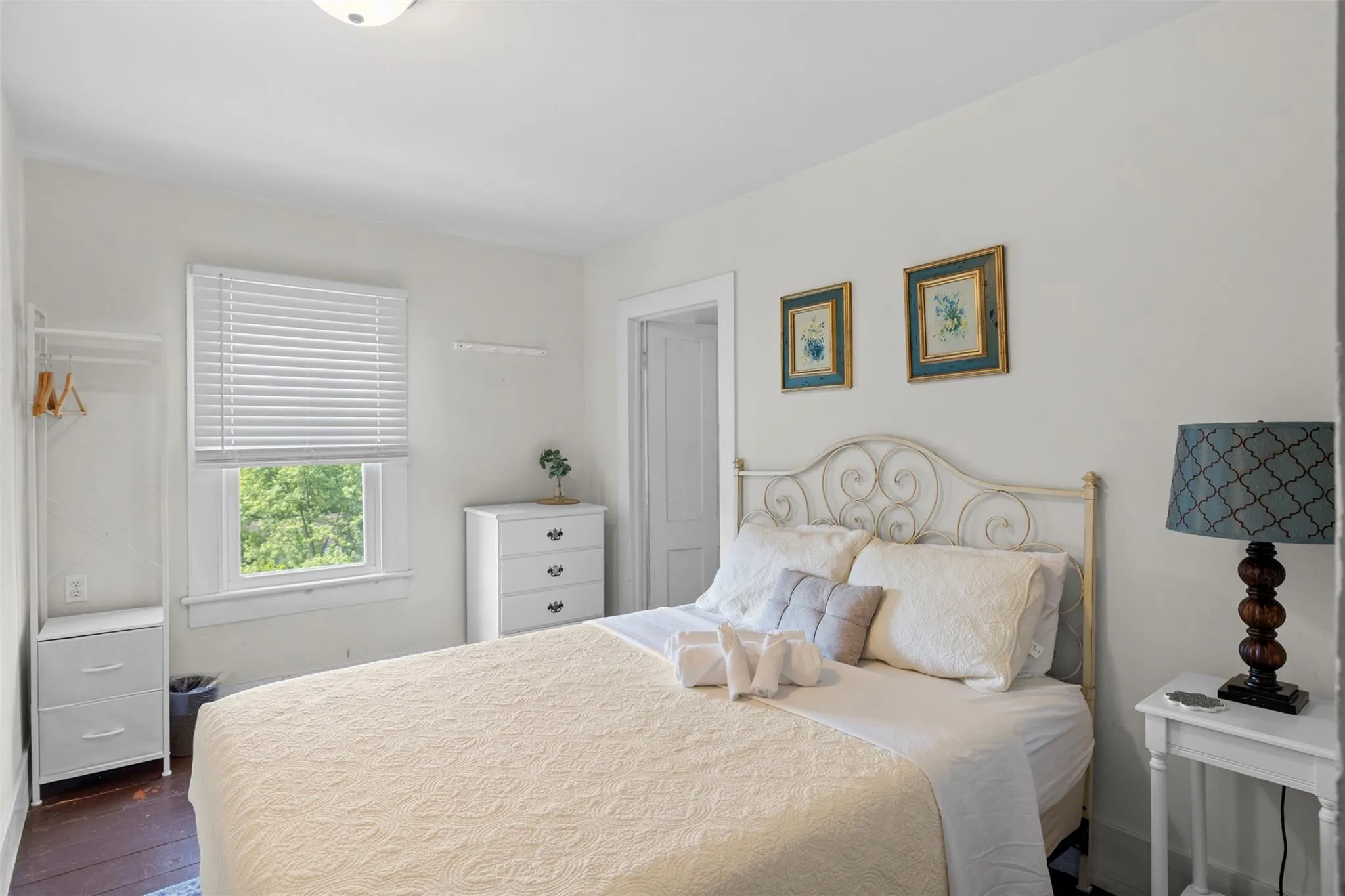 Bedroom with dark wood-style flooring Bedroom with dark wood-style flooring