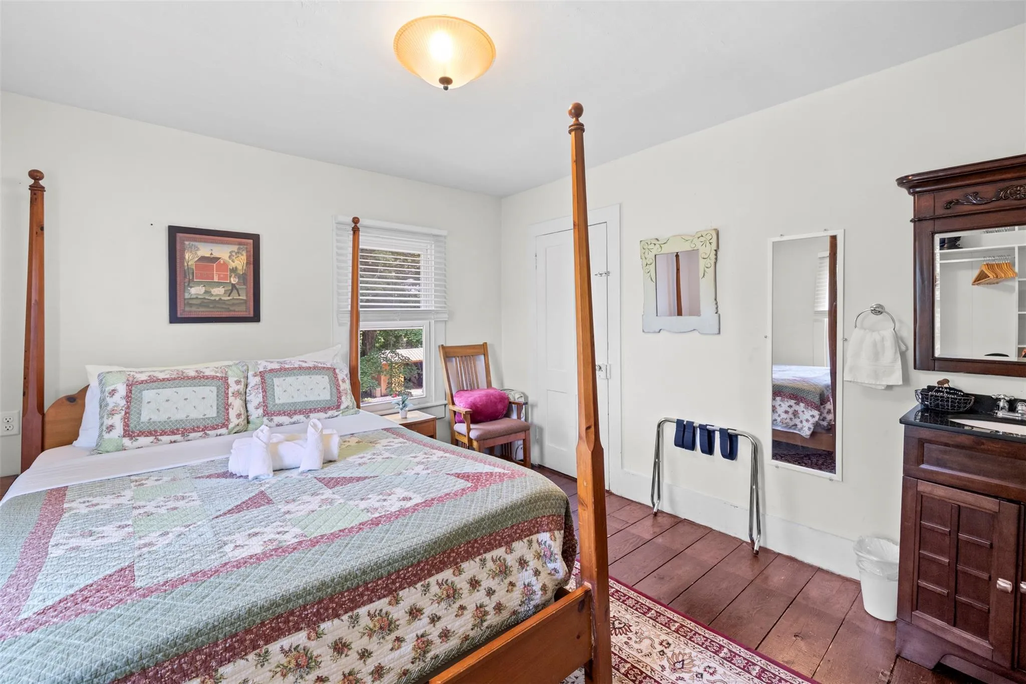 Bedroom featuring wood-type flooring and baseboards Bedroom featuring wood-type flooring and baseboards