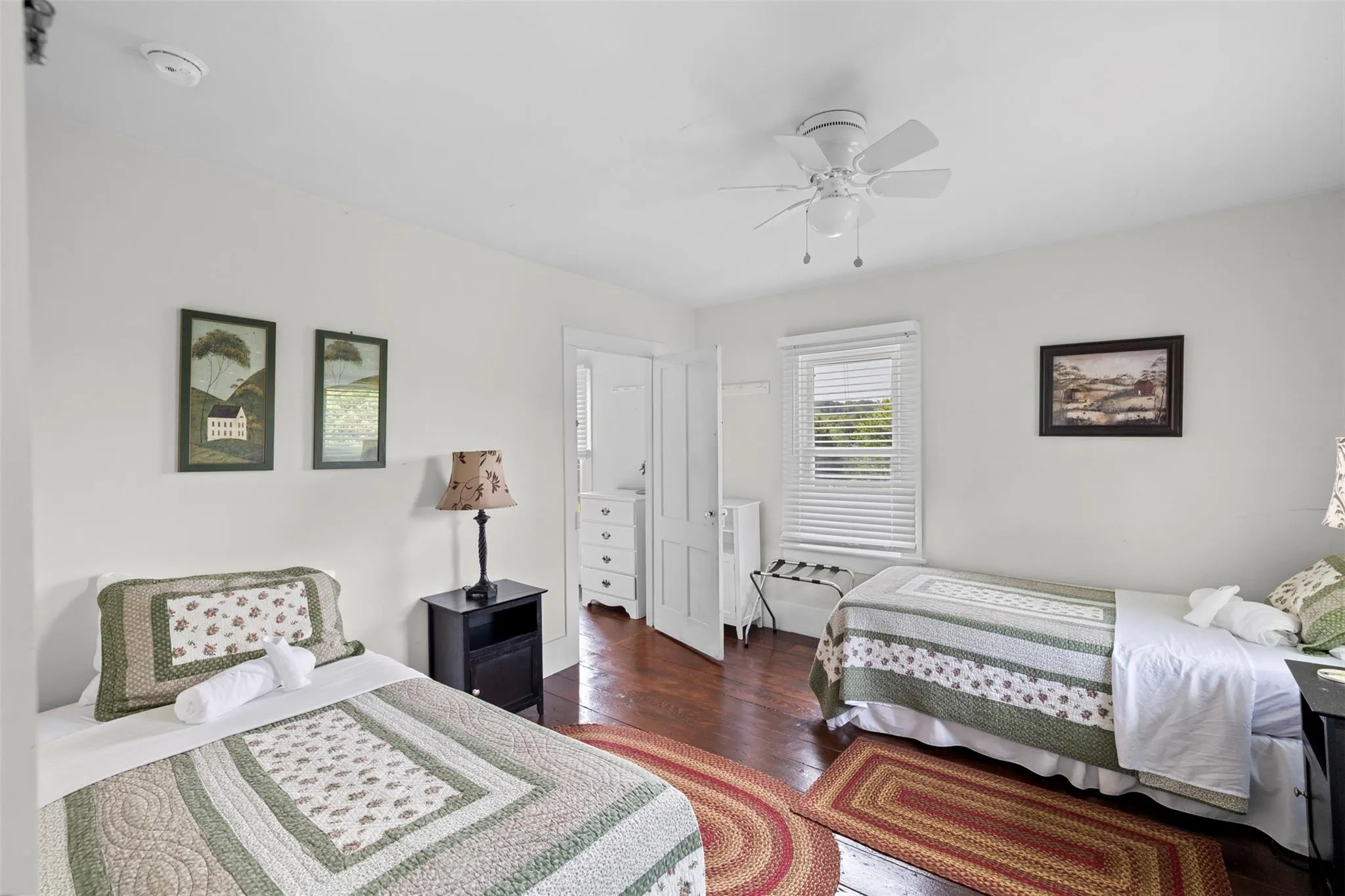 Bedroom with hardwood / wood-style floors and ceiling fan Bedroom with hardwood / wood-style floors and ceiling fan
