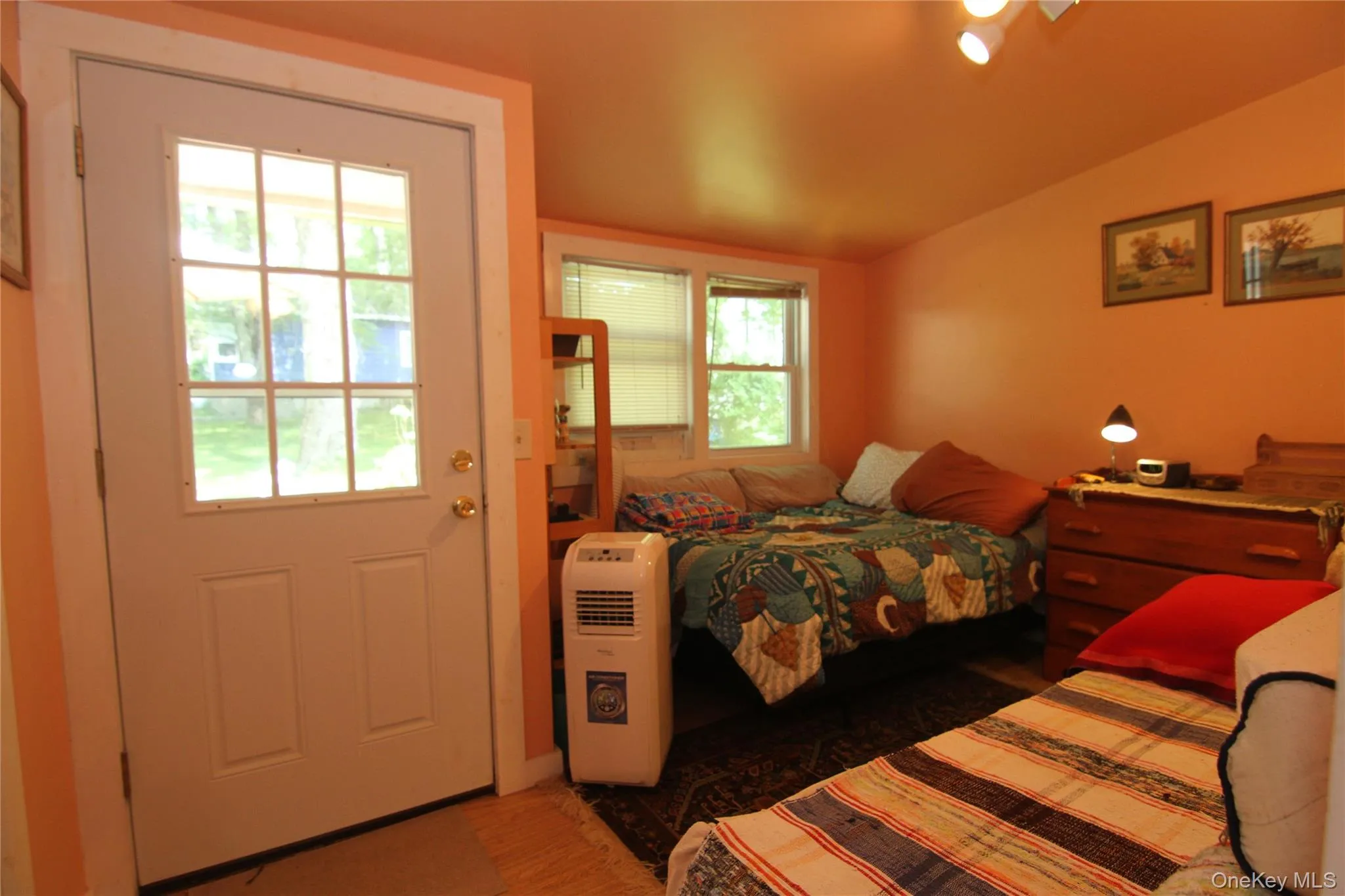 Bedroom featuring vaulted ceiling Bedroom featuring vaulted ceiling
