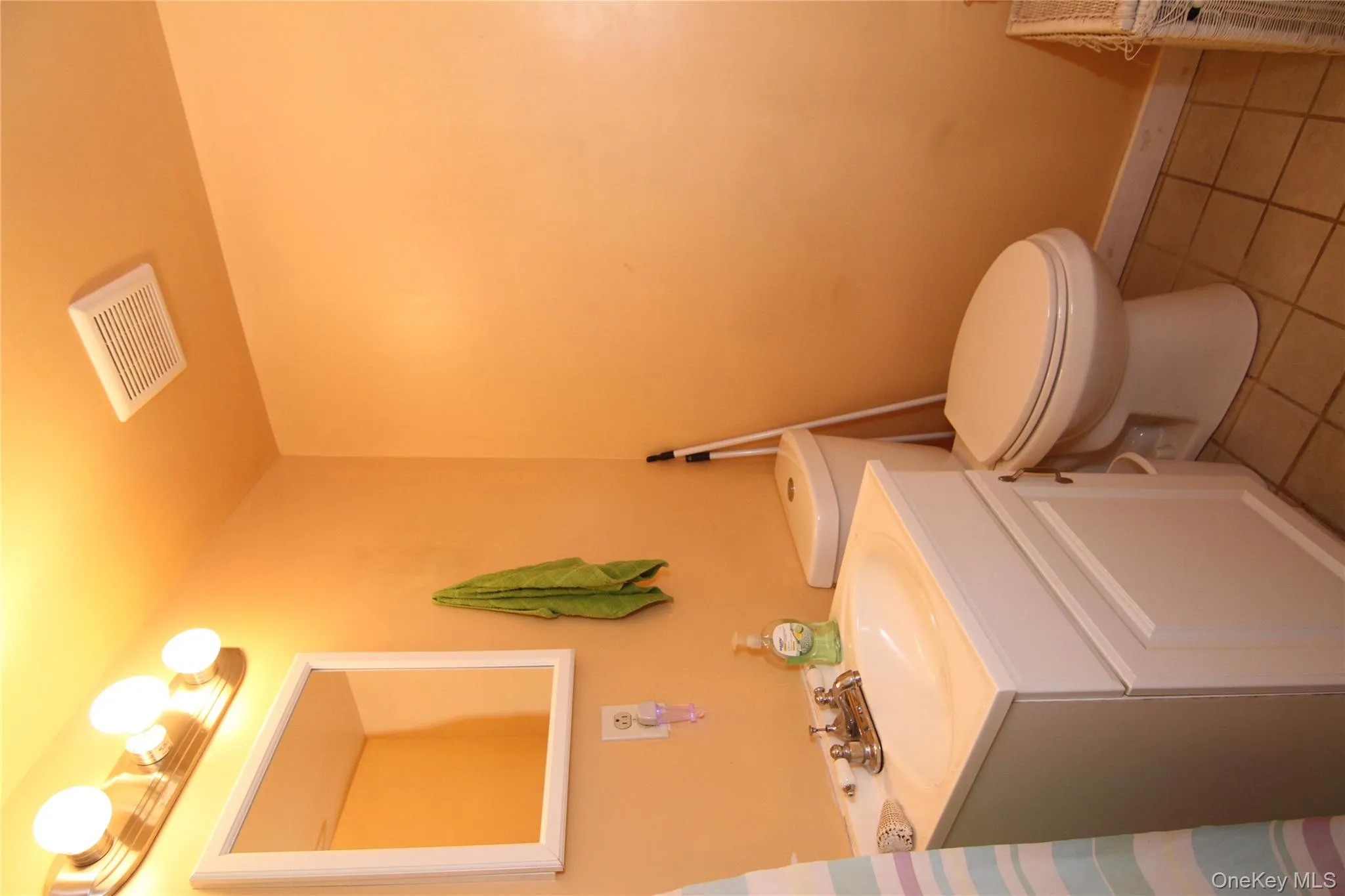 Bathroom featuring tile patterned floors and vanity Bathroom featuring tile patterned floors and vanity