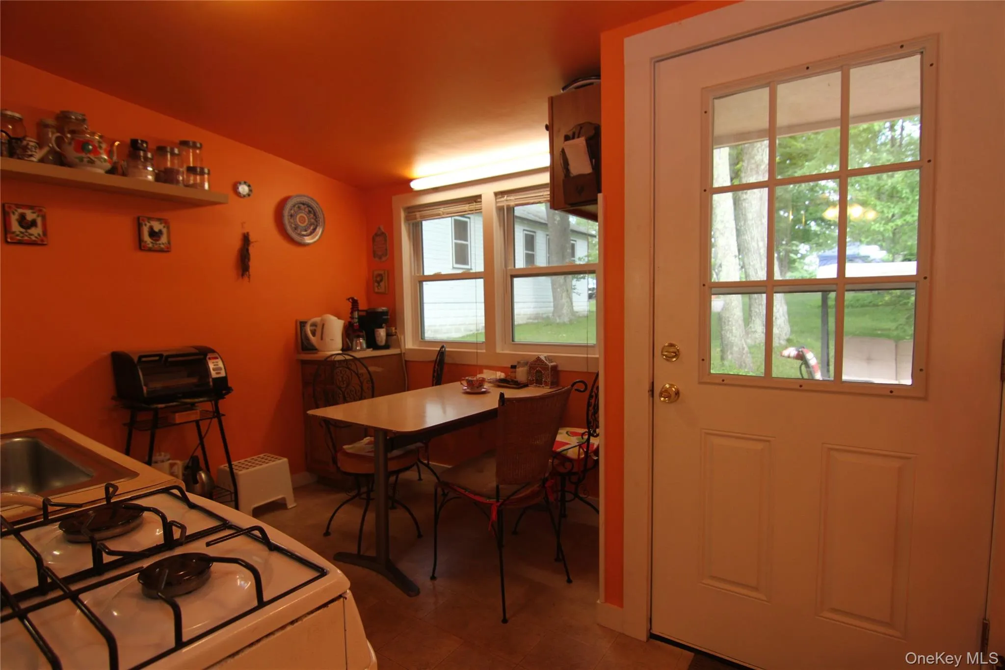 Dining area with lofted ceiling Dining area with lofted ceiling