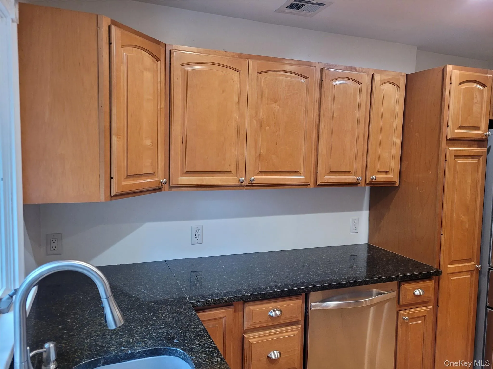 Kitchen with a sink and stainless steel dishwasher Kitchen with a sink and stainless steel dishwasher