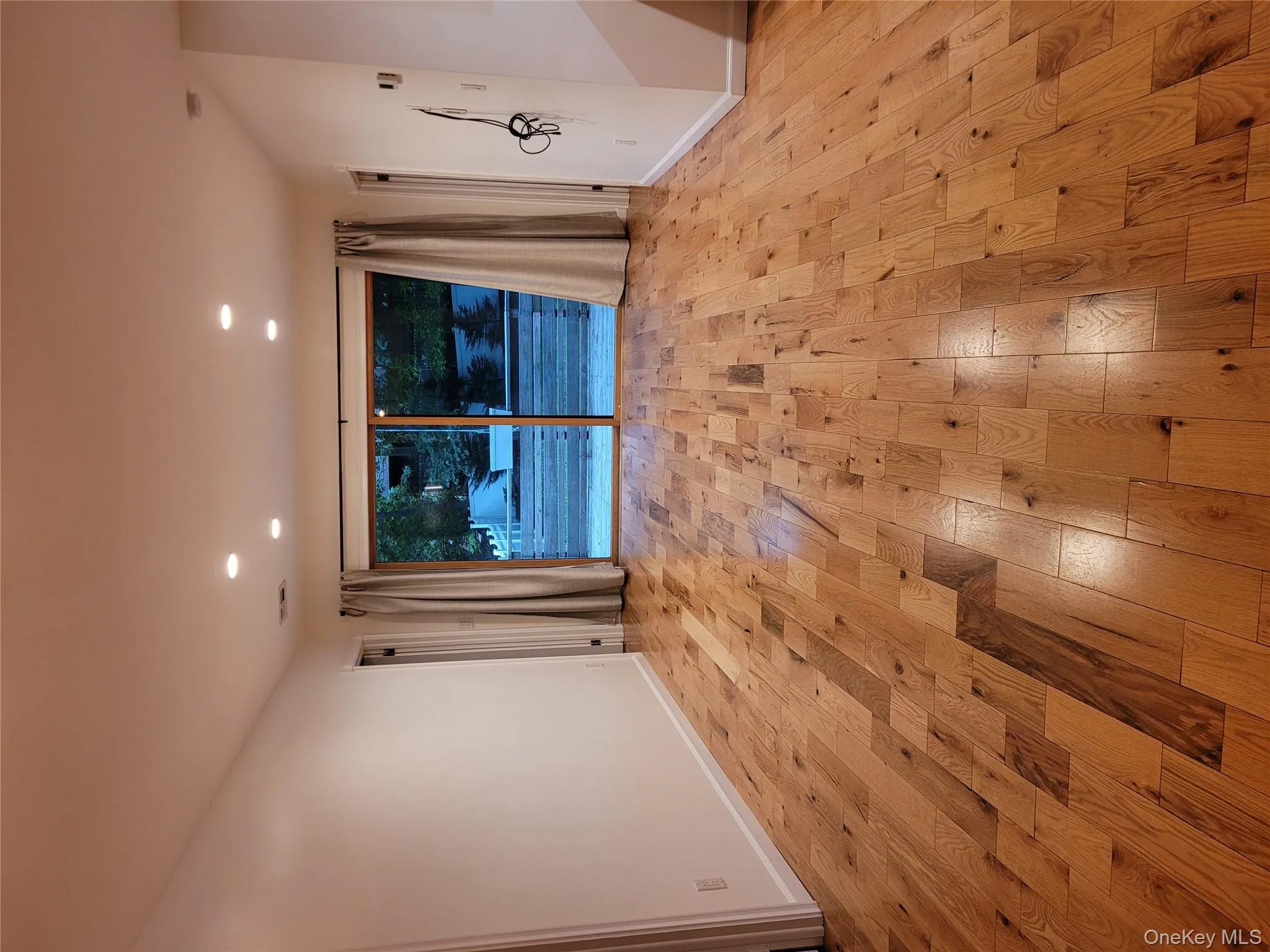 Spare room featuring light wood-style flooring and recessed lighting Spare room featuring light wood-style flooring and recessed lighting