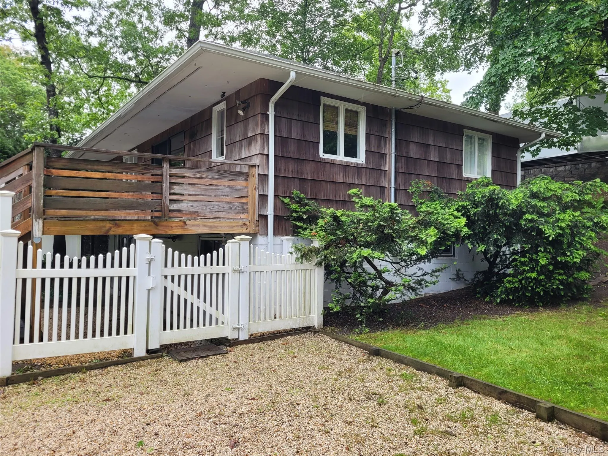 View of front of property featuring a gate View of front of property featuring a gate
