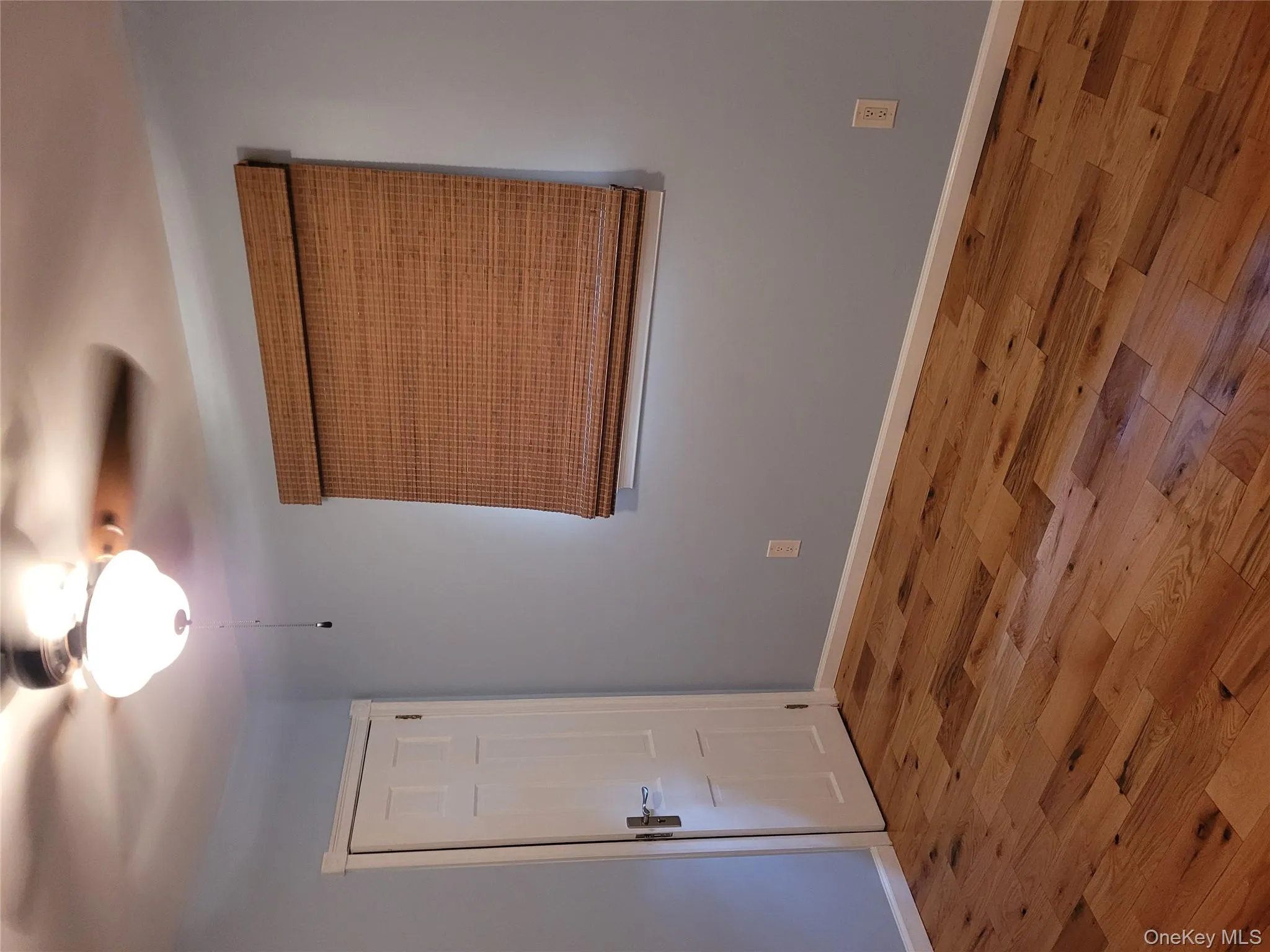 Empty room featuring a ceiling fan and wood finished floors Empty room featuring a ceiling fan and wood finished floors