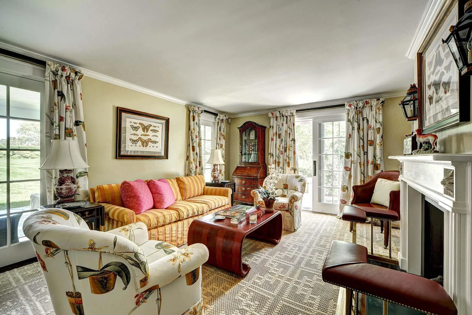 Living room featuring a fireplace and crown molding Living room featuring a fireplace and crown molding