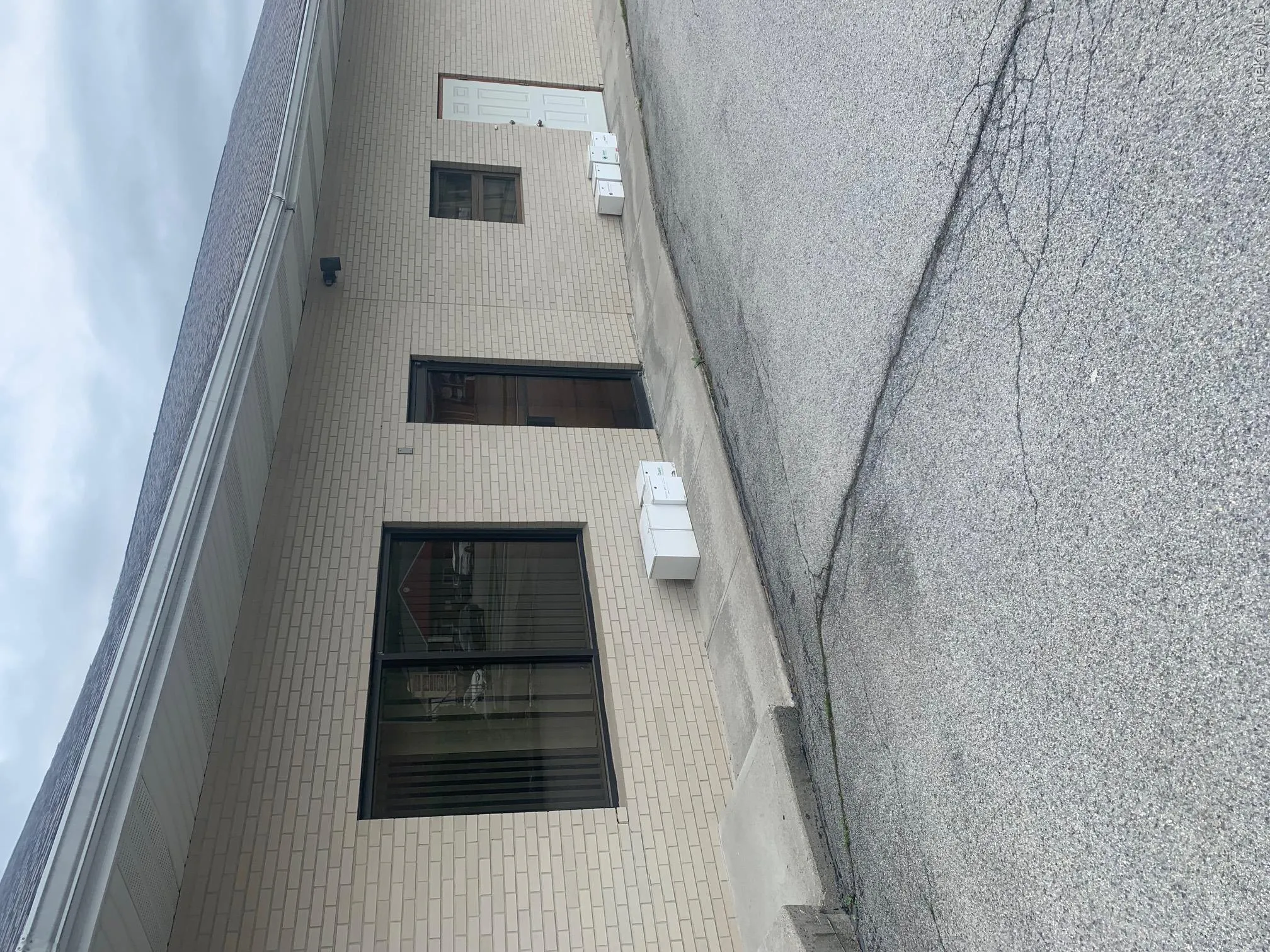 Property entrance featuring brick siding Property entrance featuring brick siding