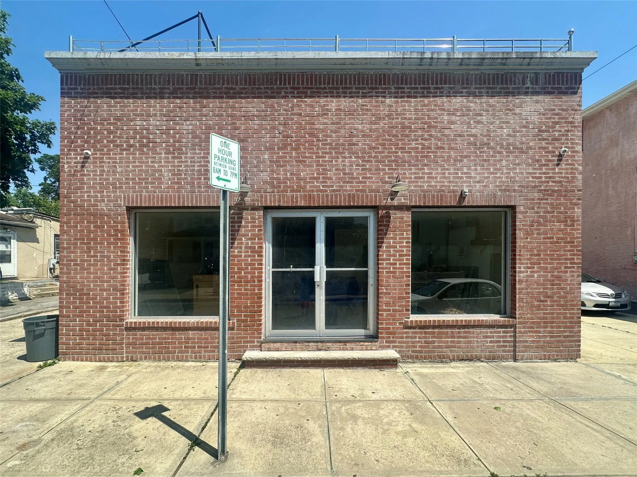 Back of house featuring brick siding and a patio area Back of house featuring brick siding and a patio area
