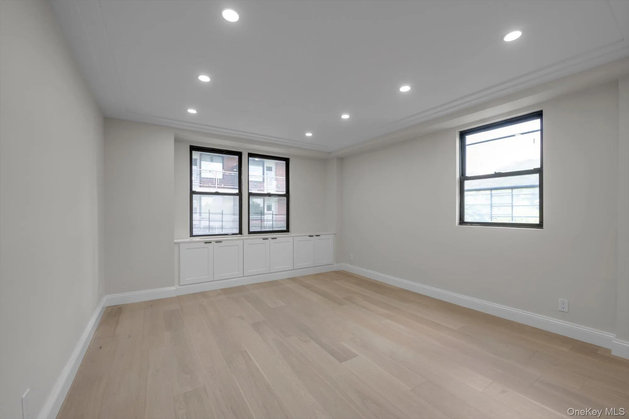 Empty room featuring light wood-style floors and recessed lighting Empty room featuring light wood-style floors and recessed lighting