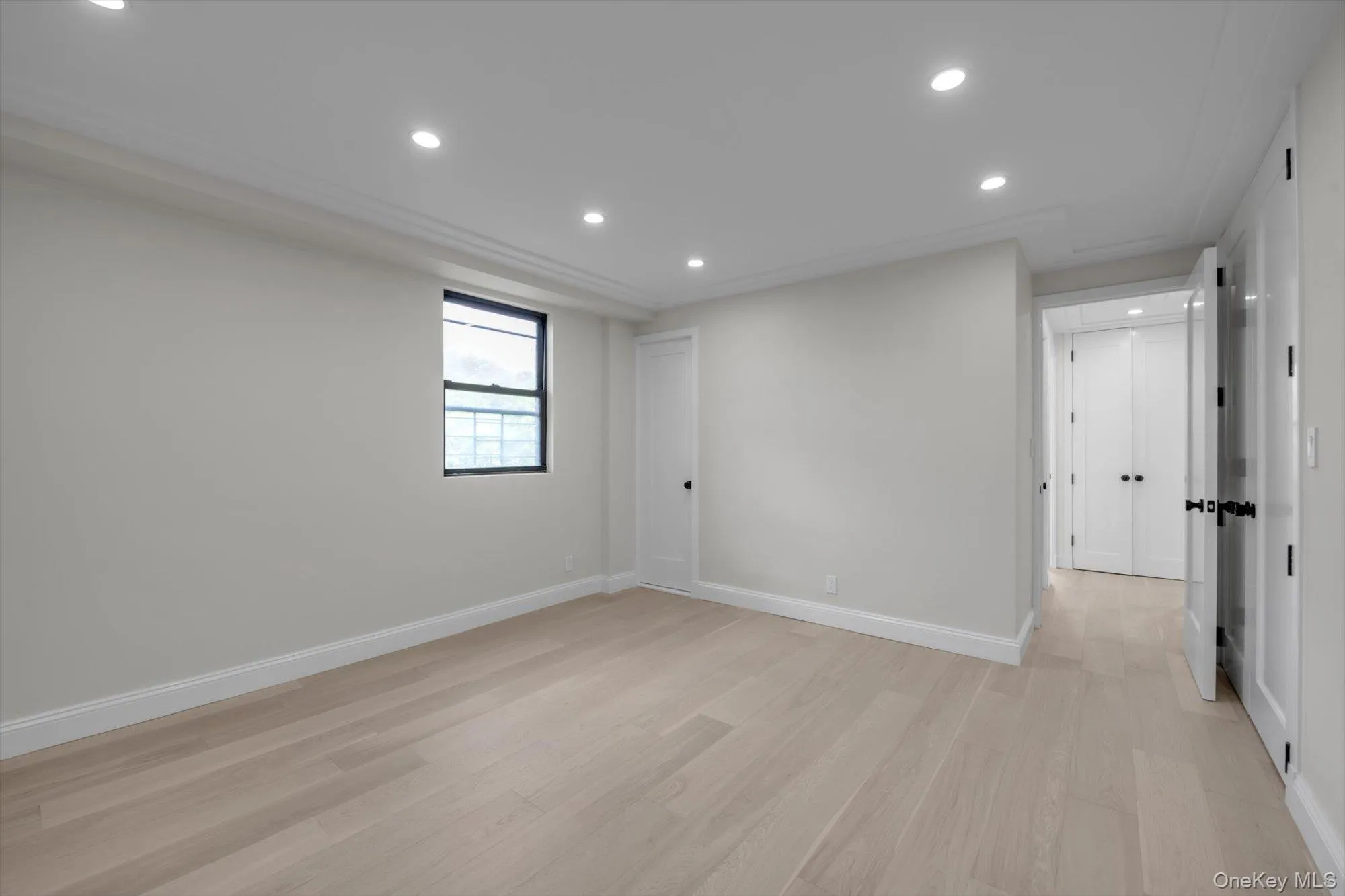 Unfurnished room featuring light wood-style flooring and recessed lighting Unfurnished room featuring light wood-style flooring and recessed lighting