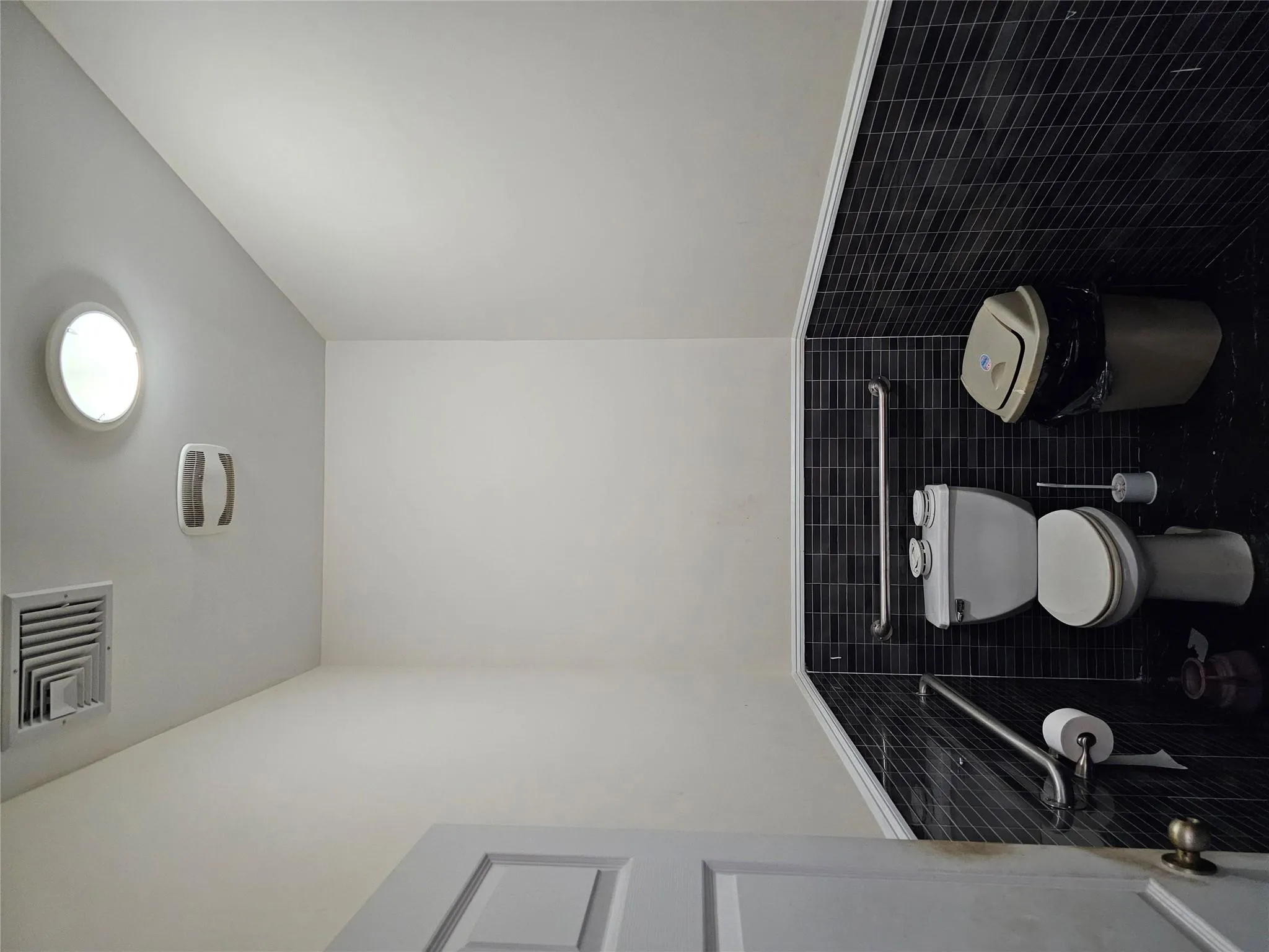 Bathroom with tile walls and wainscoting Bathroom with tile walls and wainscoting