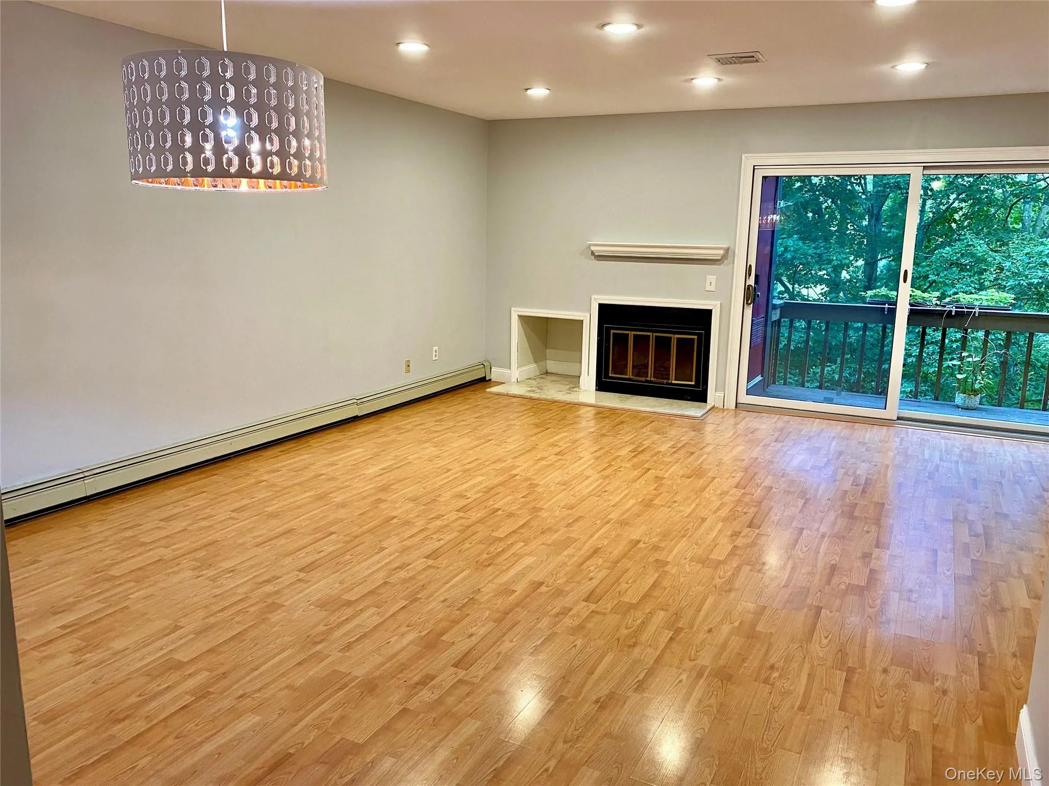 Living Room with dining area, fireplace and sliders to the deck. Living Room with dining area, fireplace and sliders to the deck.
