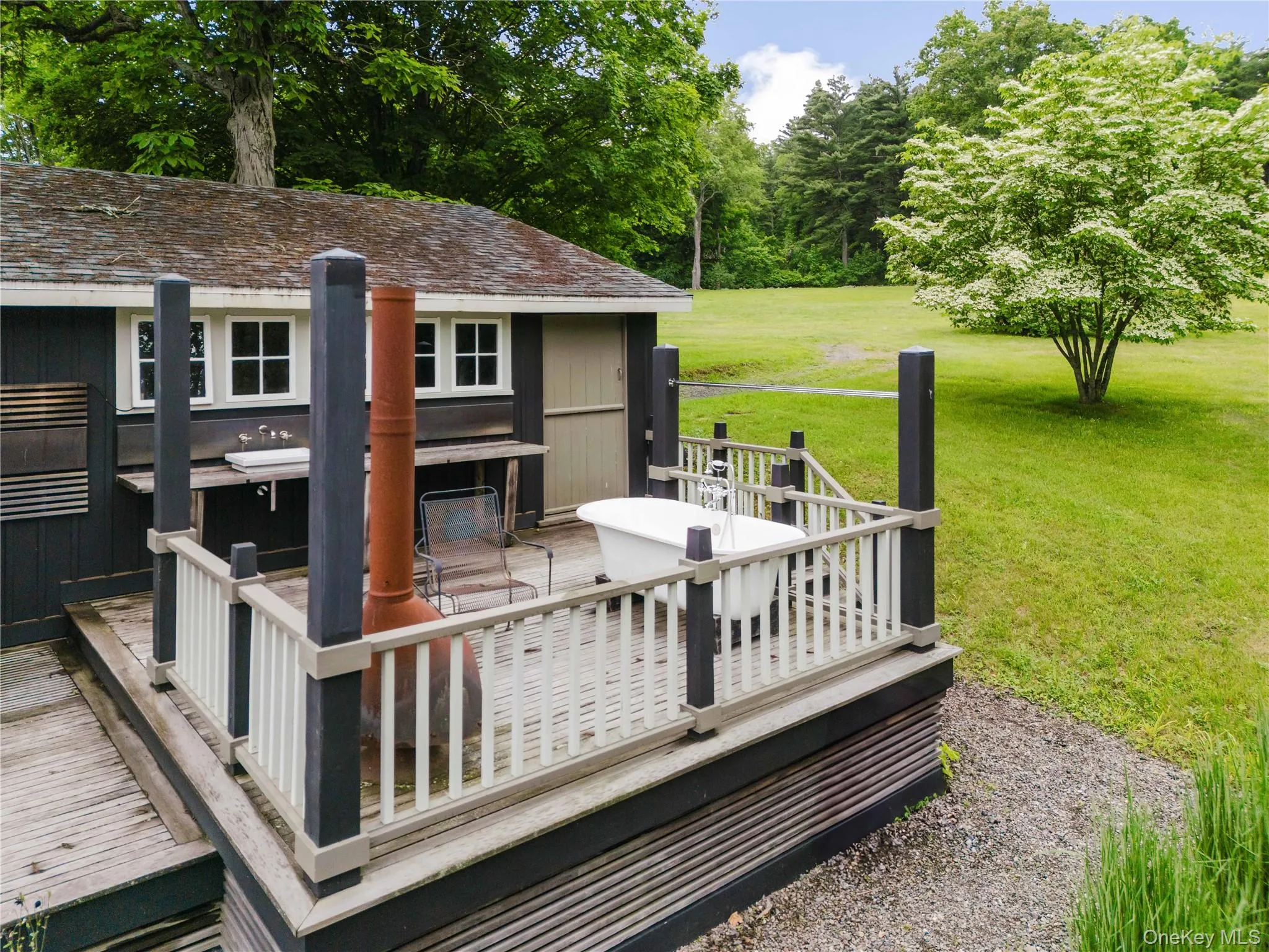 Wooden terrace featuring a yard Wooden terrace featuring a yard
