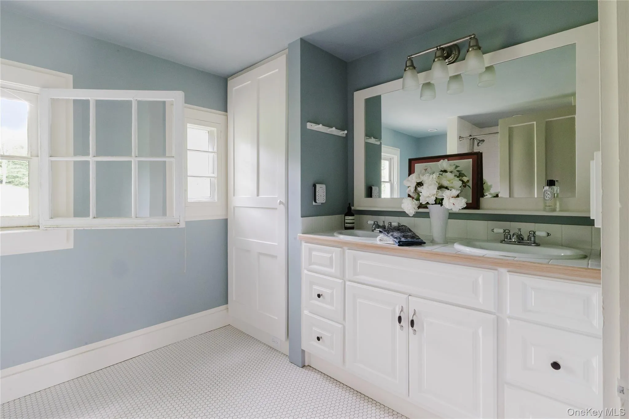 Full bathroom with double vanity and a shower Full bathroom with double vanity and a shower