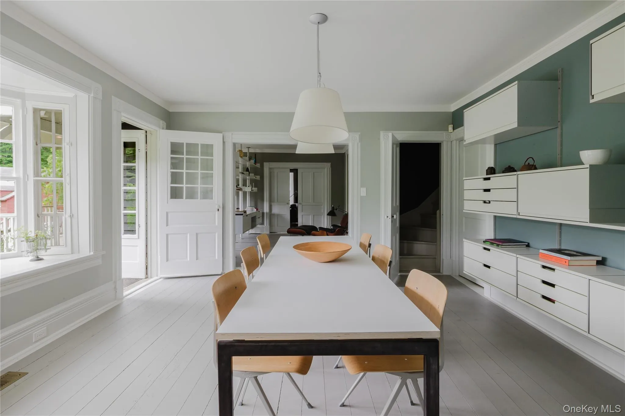 Dining space featuring ornamental molding and wood finished floors Dining space featuring ornamental molding and wood finished floors