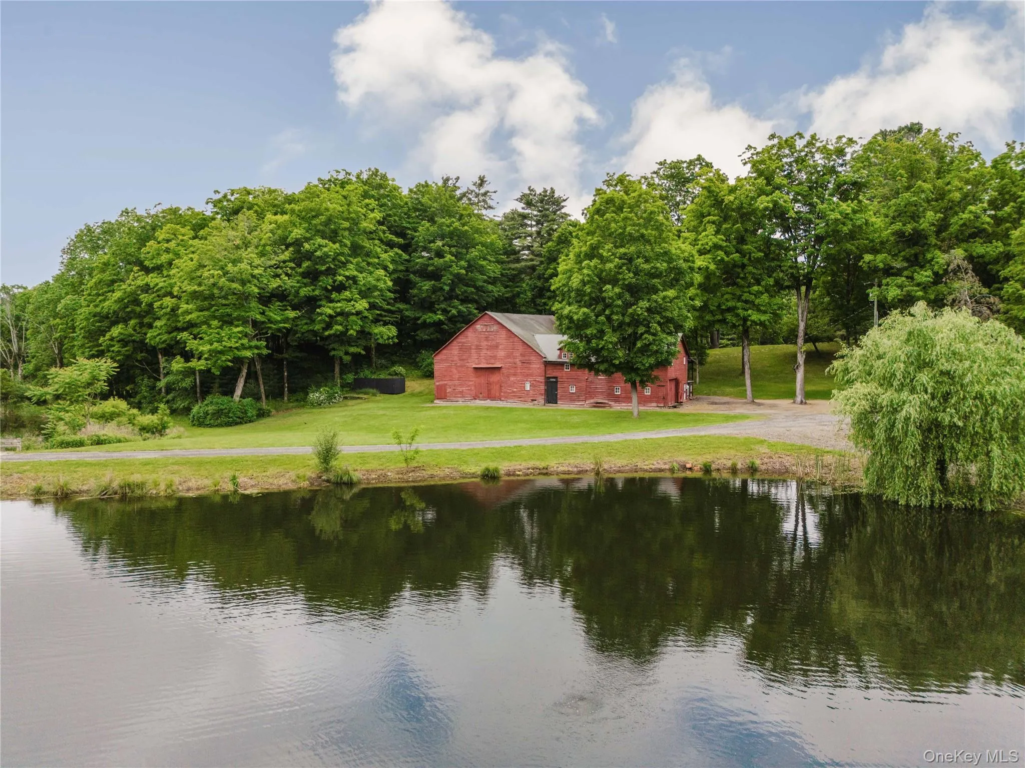 Water view featuring a barn Water view featuring a barn