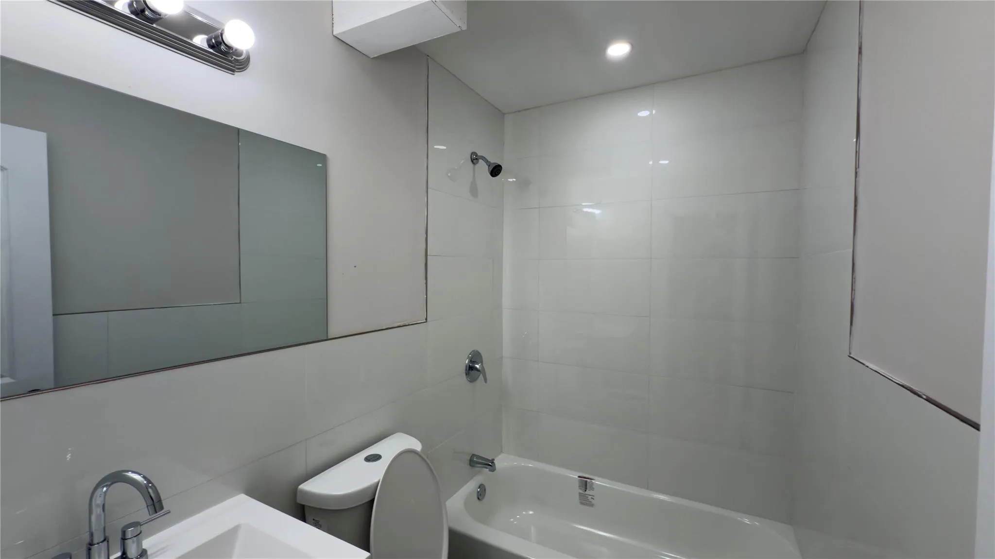 Bathroom with washtub / shower combination and vanity Bathroom with washtub / shower combination and vanity