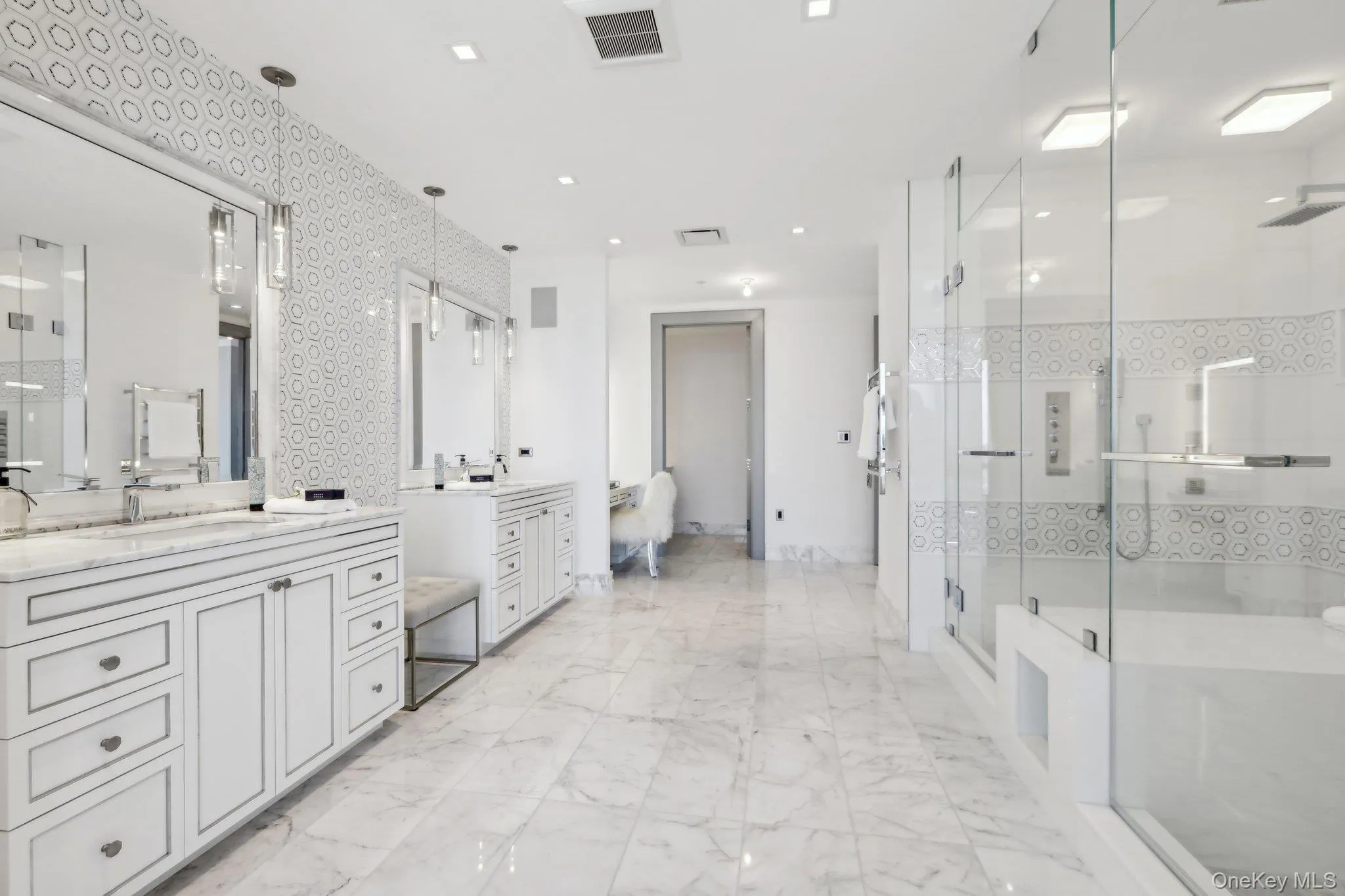 Primary Bath North with three vanities and double shower Primary Bath North with three vanities and double shower