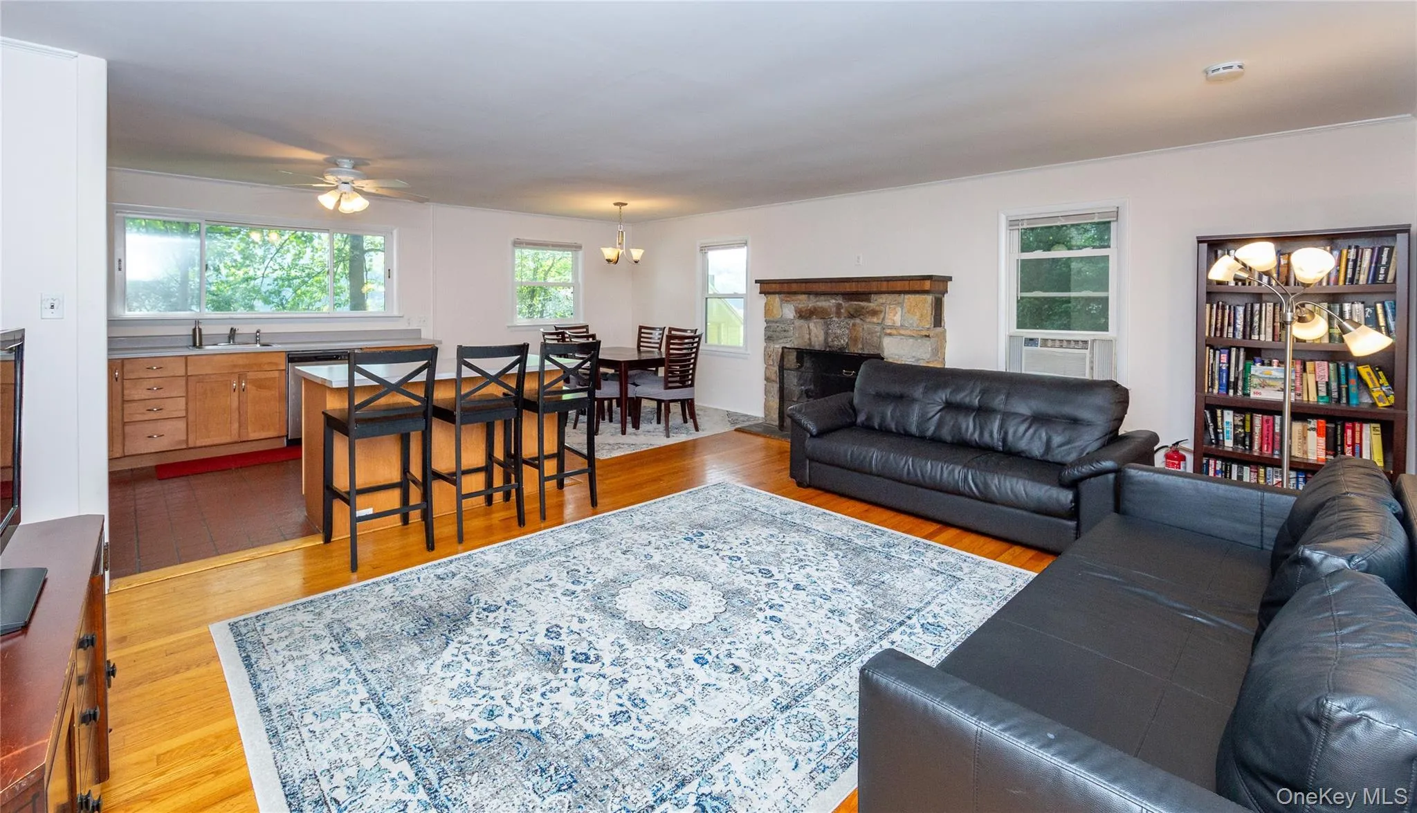 ...between the living room, dining room and kitchen. ...between the living room, dining room and kitchen.