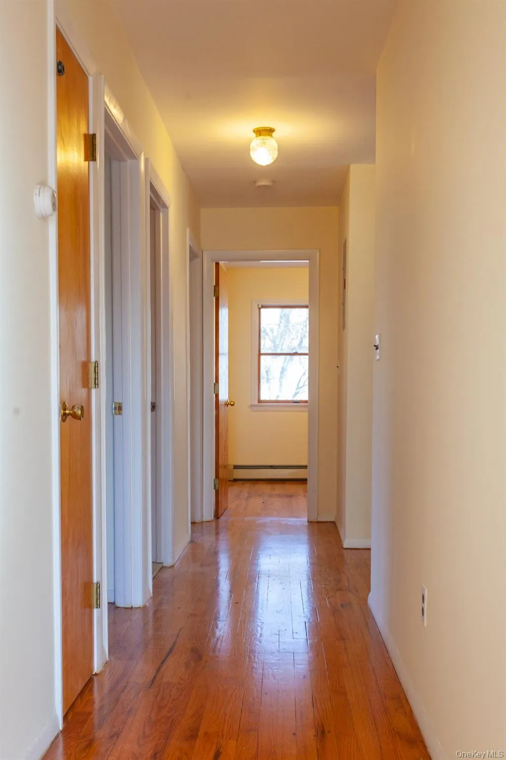 Hallway featuring light hardwood flooring. Hallway featuring light hardwood flooring.