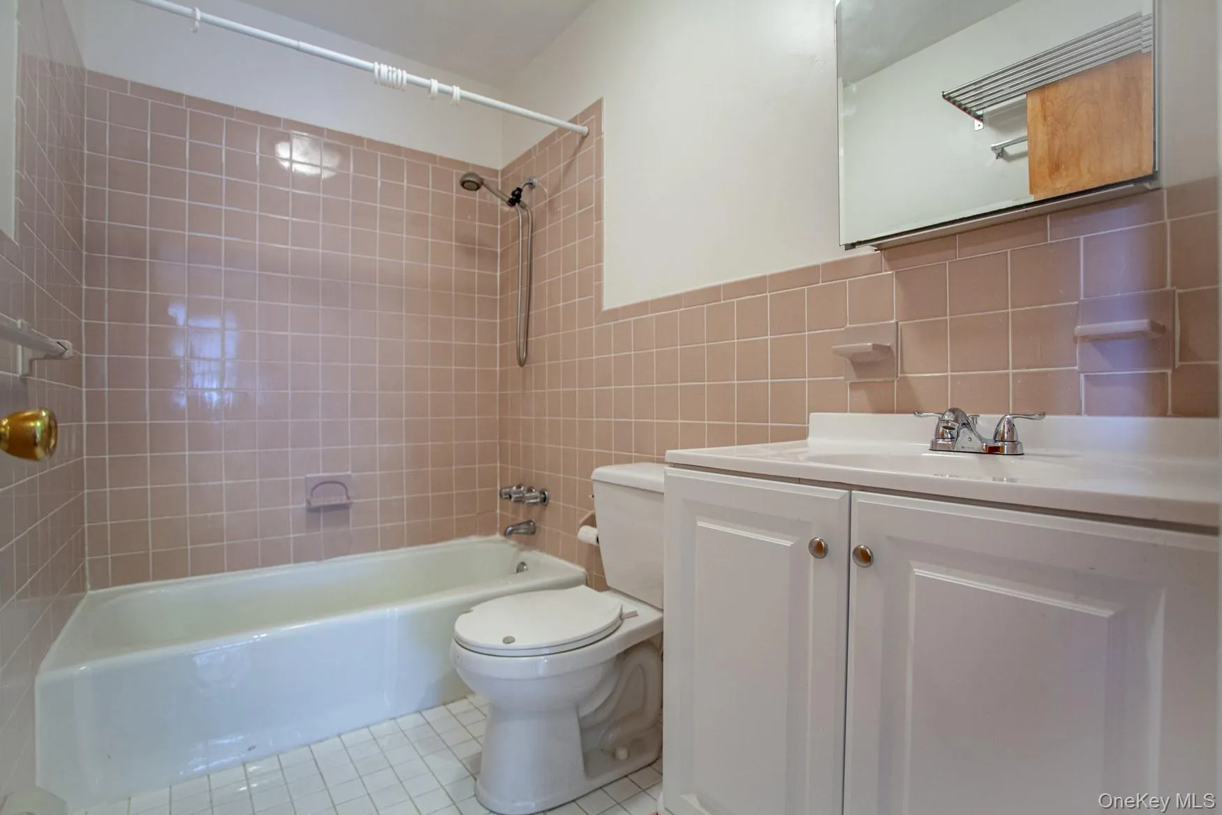 Full bath #2 with tub / shower combination, vanity, tile walls, light tile patterned flooring, and decorative backsplash. Full bath #2 with tub / shower combination, vanity, tile walls, light tile patterned flooring, and decorative backsplash.