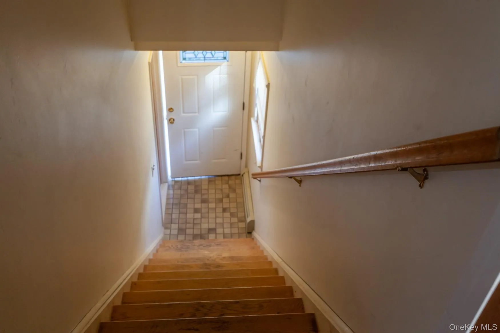 Entry stairway with hardwood floors. Entry stairway with hardwood floors.