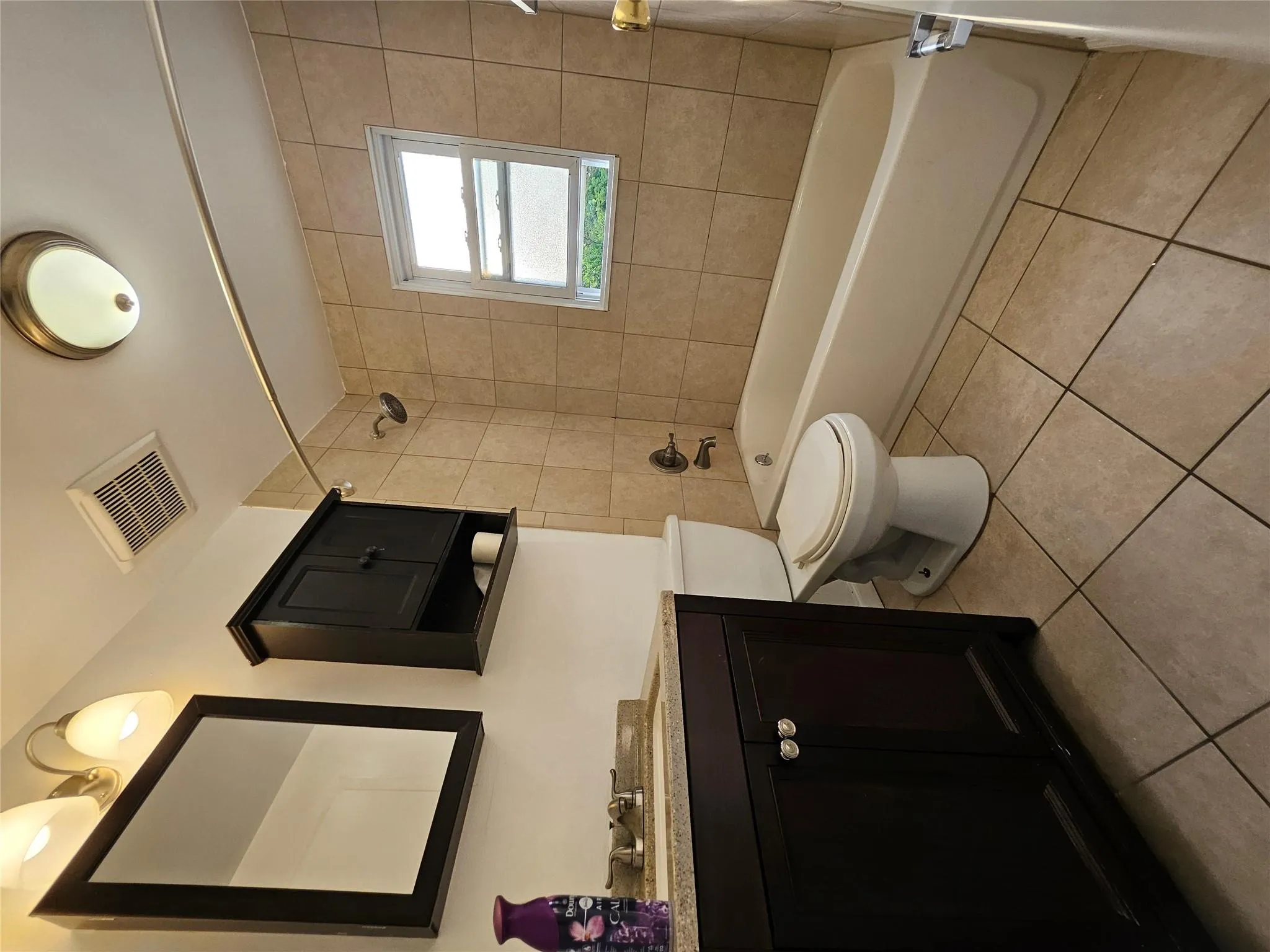 Full bath with vanity, shower combination, and tile patterned flooring Full bath with vanity, shower combination, and tile patterned flooring