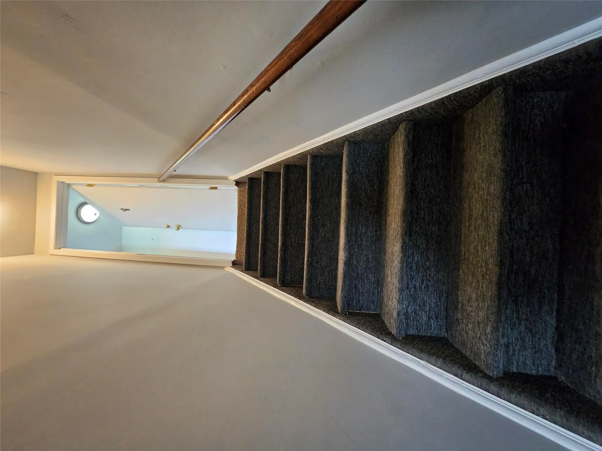 Staircase featuring carpet floors and baseboards Staircase featuring carpet floors and baseboards