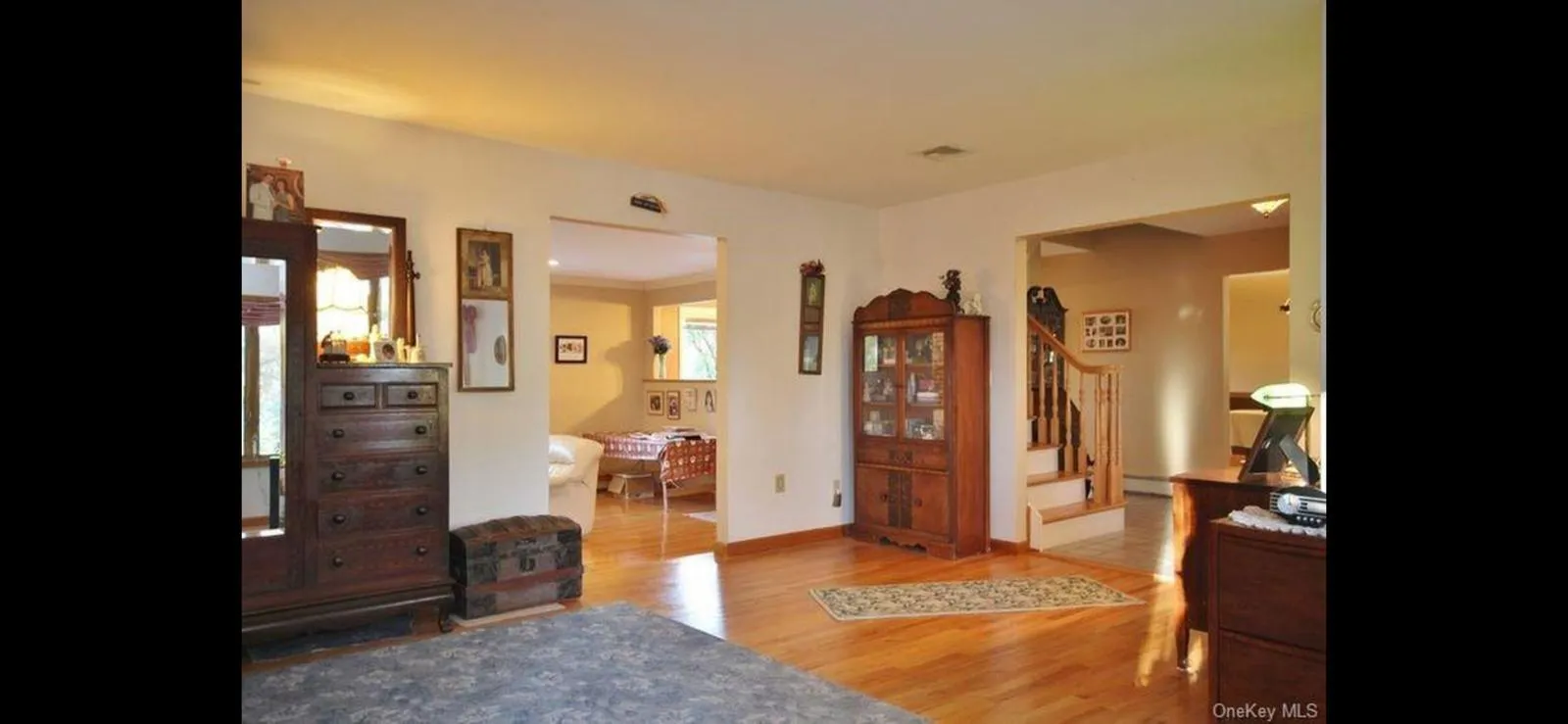 Entryway featuring stairs and wood finished floors Entryway featuring stairs and wood finished floors