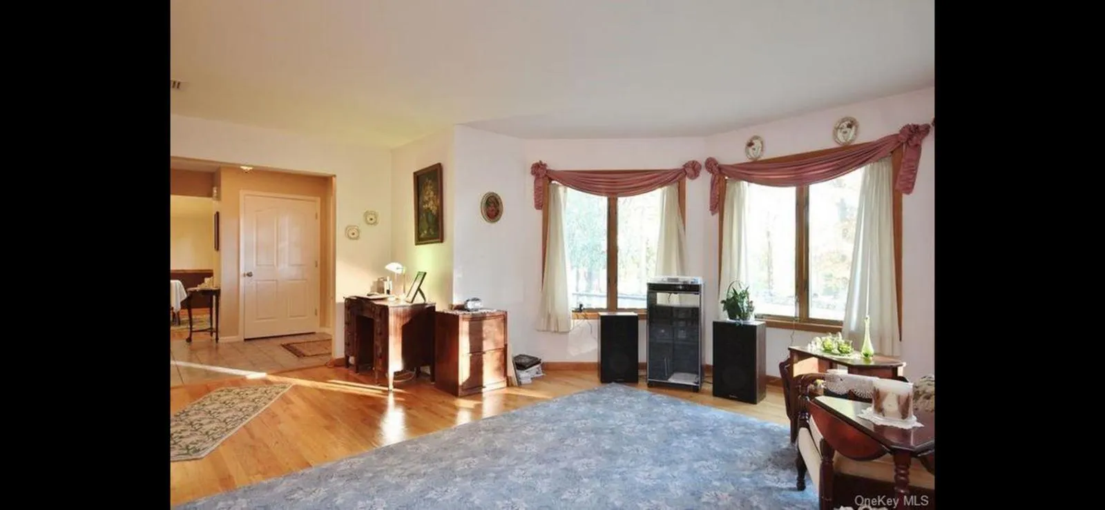 Office space with wood finished floors and baseboards Office space with wood finished floors and baseboards