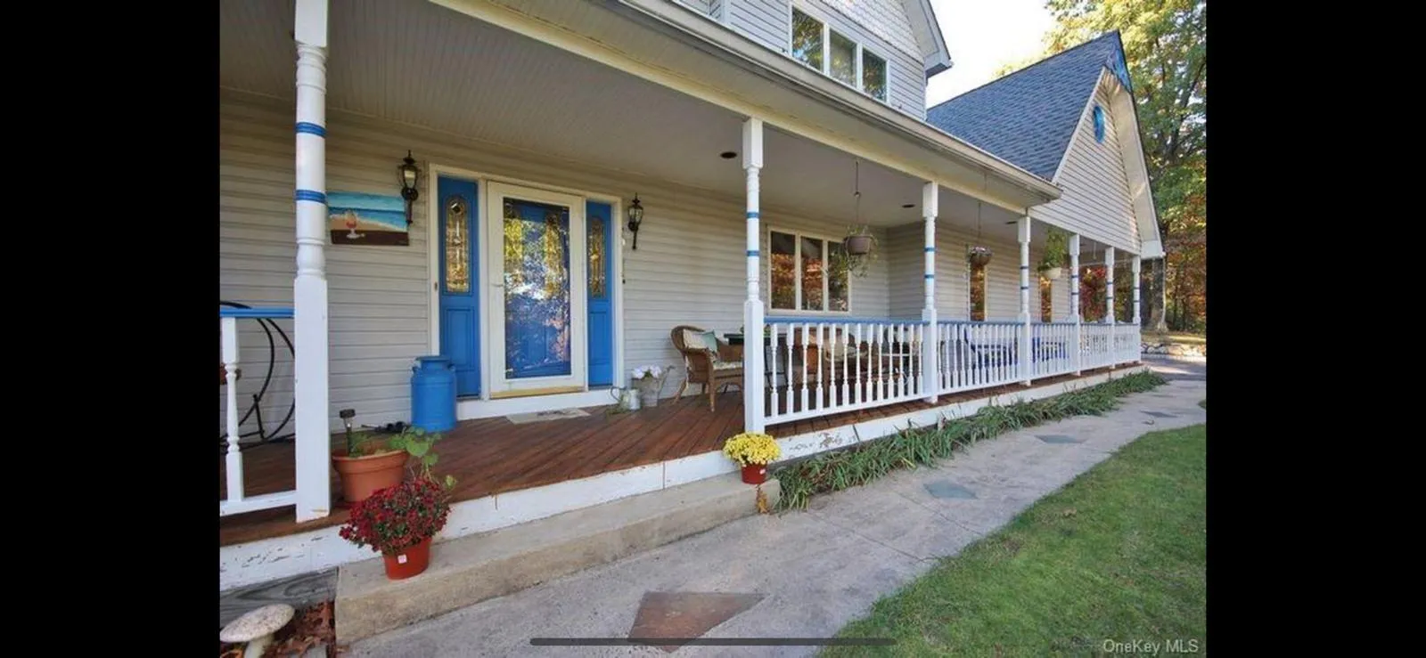Entrance to property with covered porch and roof with shingles Entrance to property with covered porch and roof with shingles