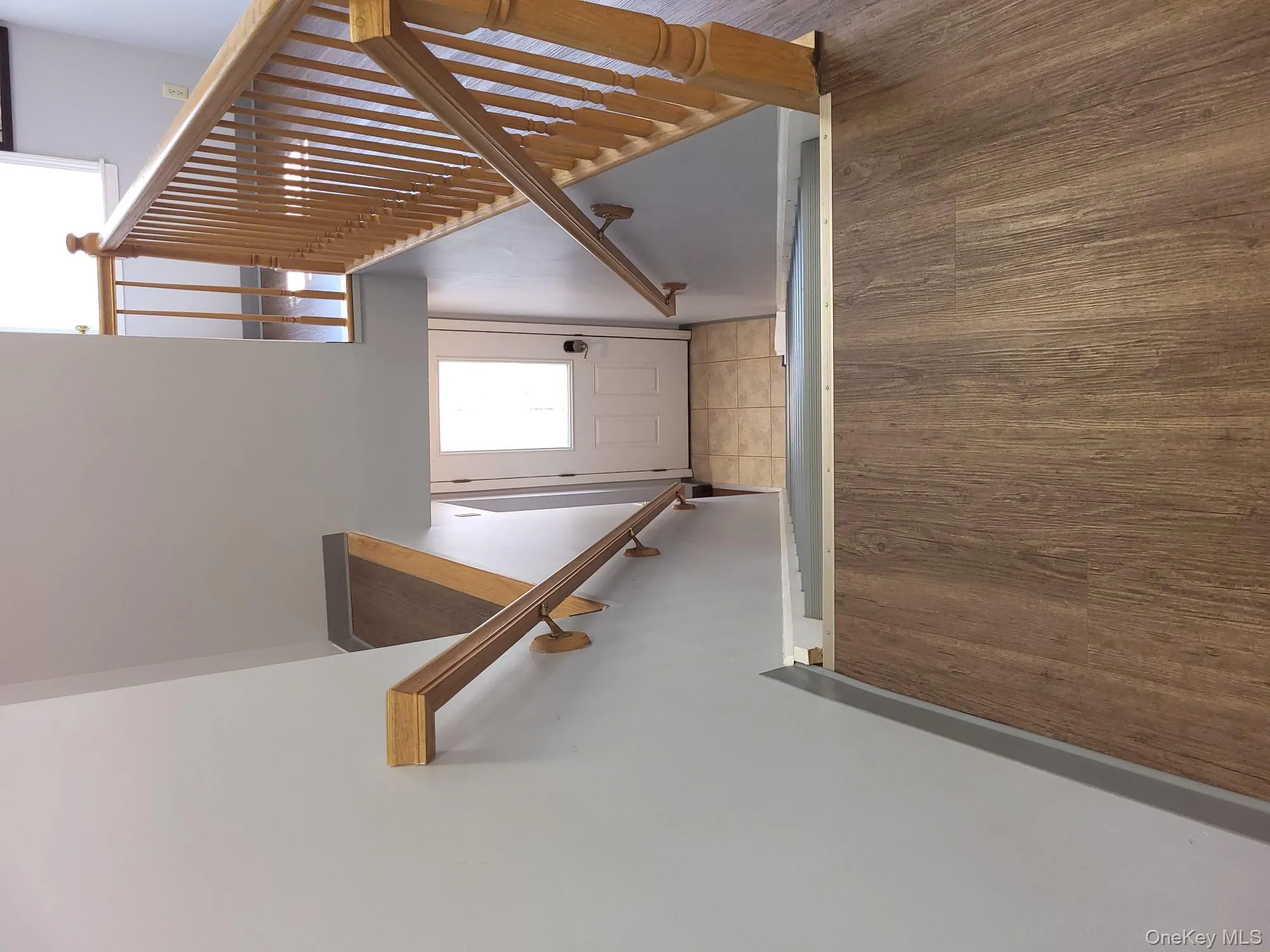Staircase with wood finished floors and baseboards Staircase with wood finished floors and baseboards