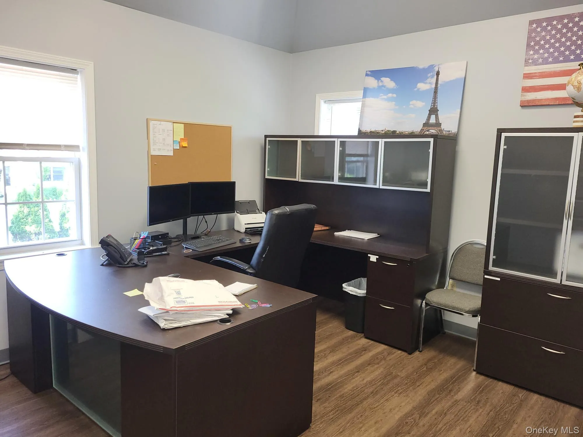Office area with dark wood-style floors Office area with dark wood-style floors
