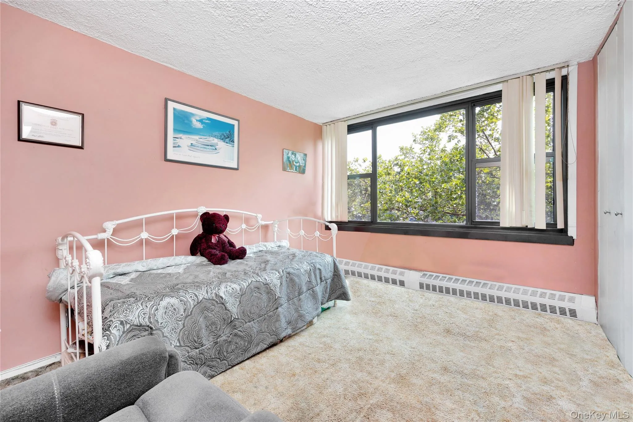 Bedroom featuring carpet and a textured ceiling Bedroom featuring carpet and a textured ceiling