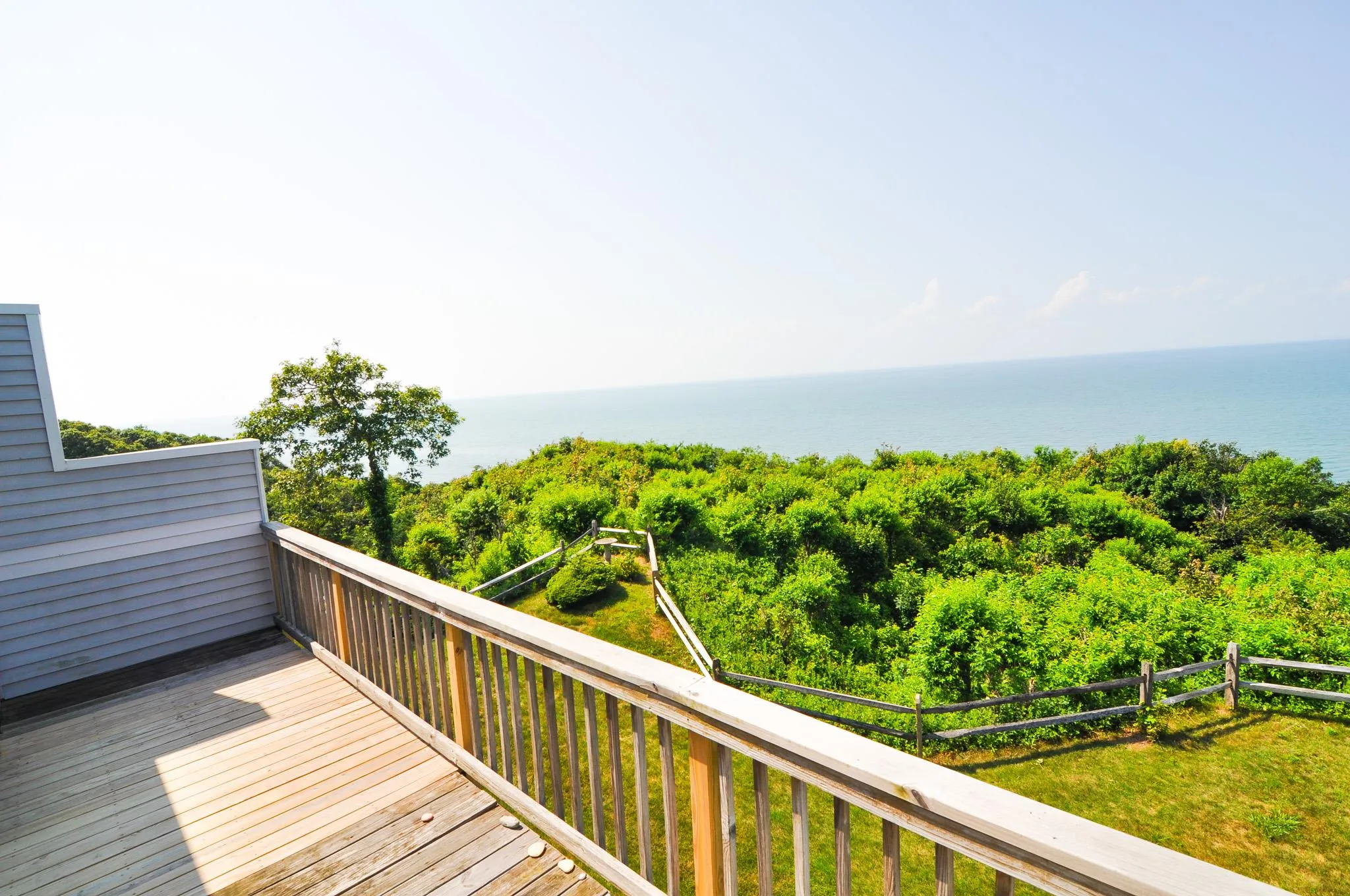 Wooden deck with a water view Wooden deck with a water view