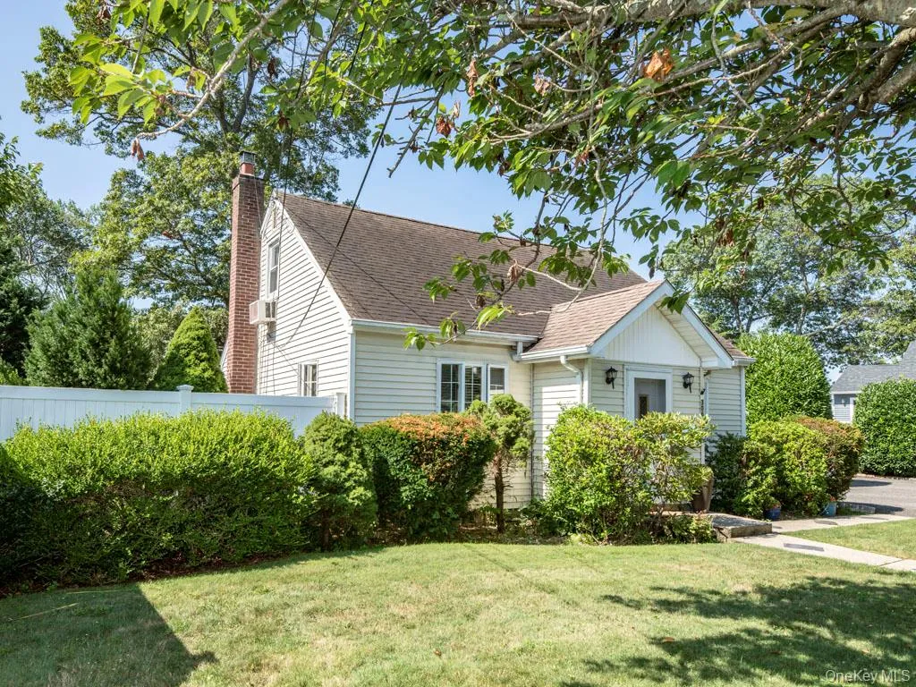 View of front of property featuring roof with shingles and a chimney View of front of property featuring roof with shingles and a chimney