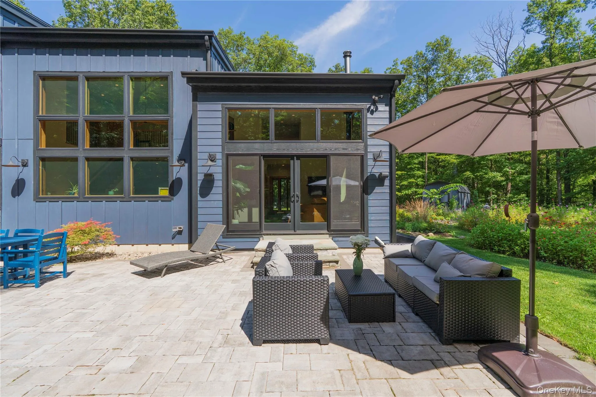 Living Room Door to Stone Patio Sitting Area Living Room Door to Stone Patio Sitting Area