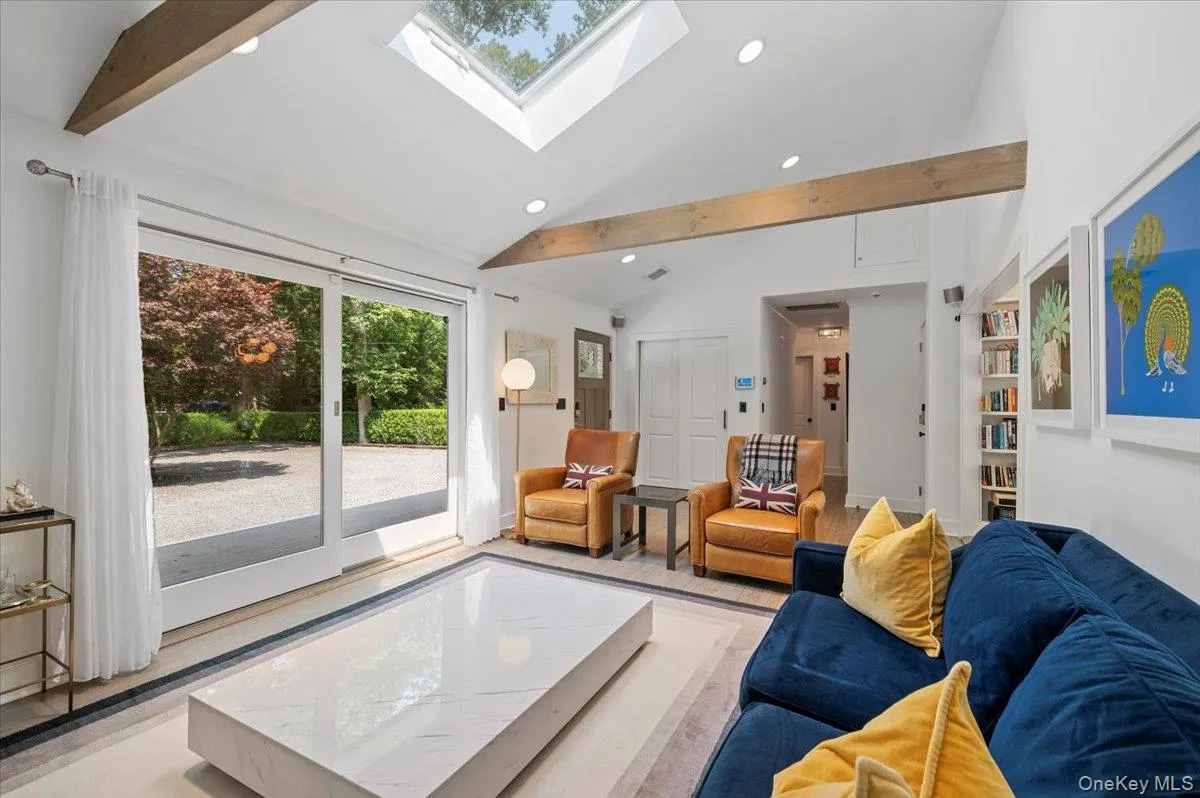 Living area with recessed lighting and a skylight Living area with recessed lighting and a skylight