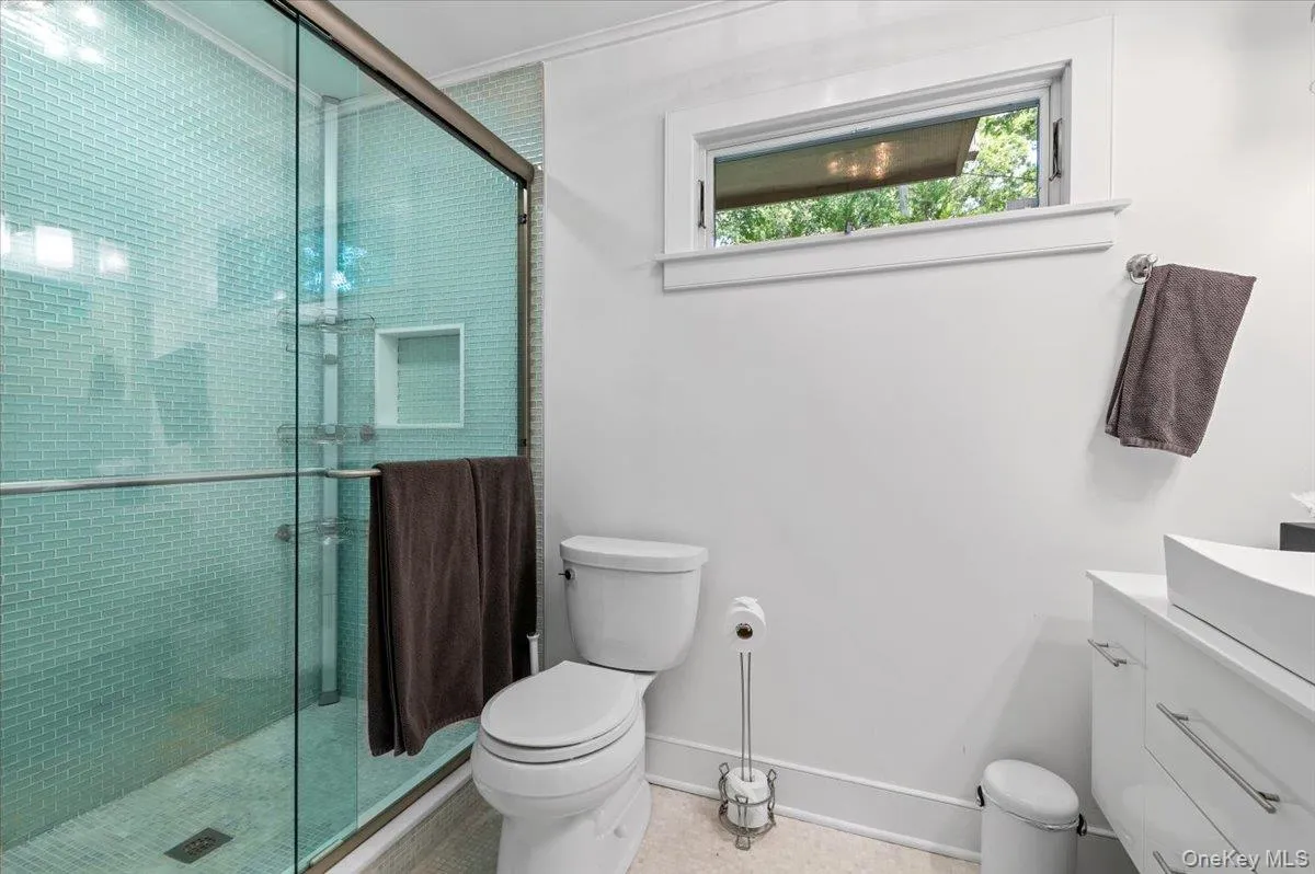 Full bath with vanity and a shower stall Full bath with vanity and a shower stall