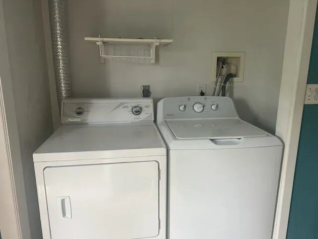Laundry room with washing machine and clothes dryer Laundry room with washing machine and clothes dryer