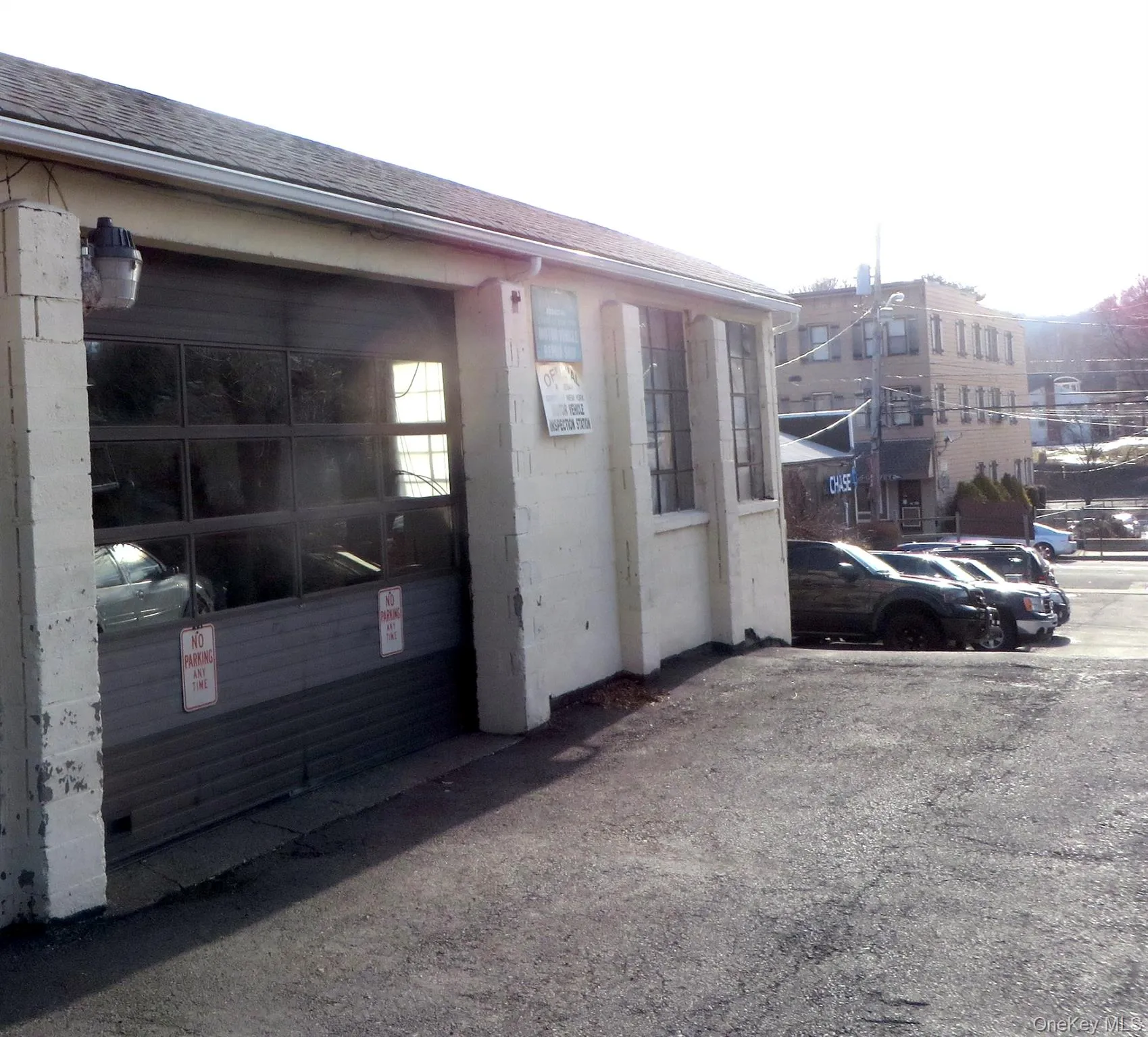 View of side of home with a shingled roof View of side of home with a shingled roof